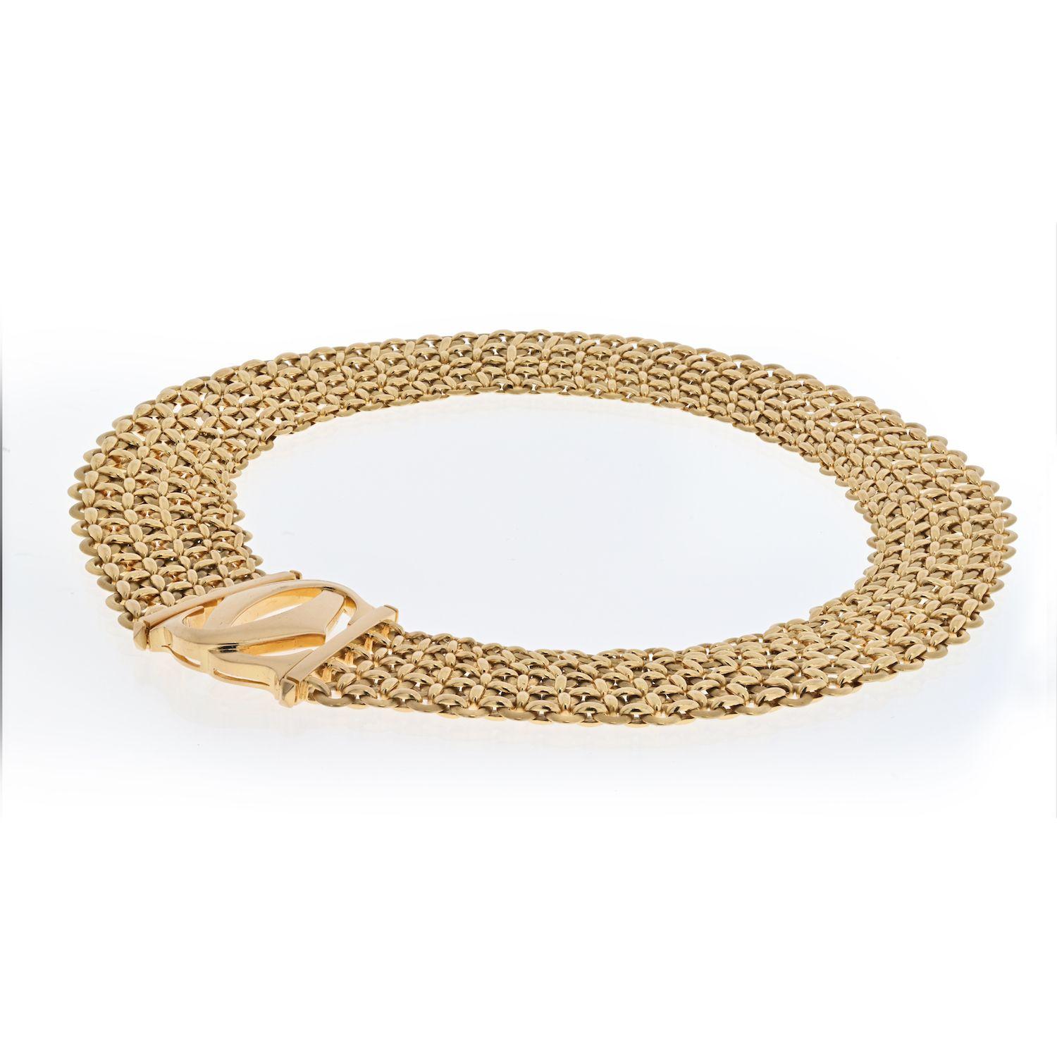 Vintage staple by Cartier 18K Yellow Gold, it is from the Double C Penelope collection, made with three rows of gold links, fits like a collar necklace. Chic and elegant.
Length: 16 inches.
Width: 20mm Double C width: 24mm
207 grams. 