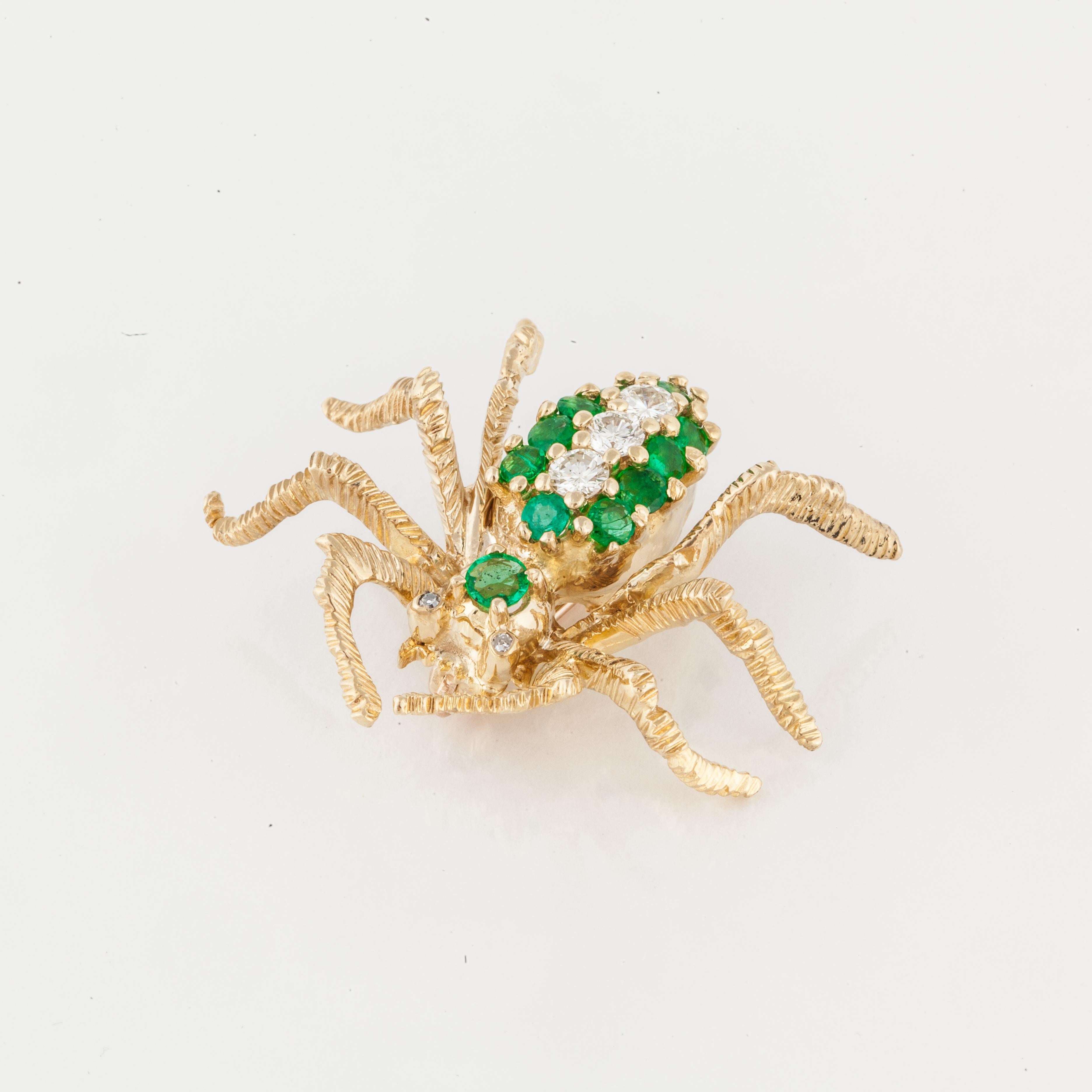 Cartier spider pin composed of 18K yellow gold with emeralds and diamonds.  The pin is marked 