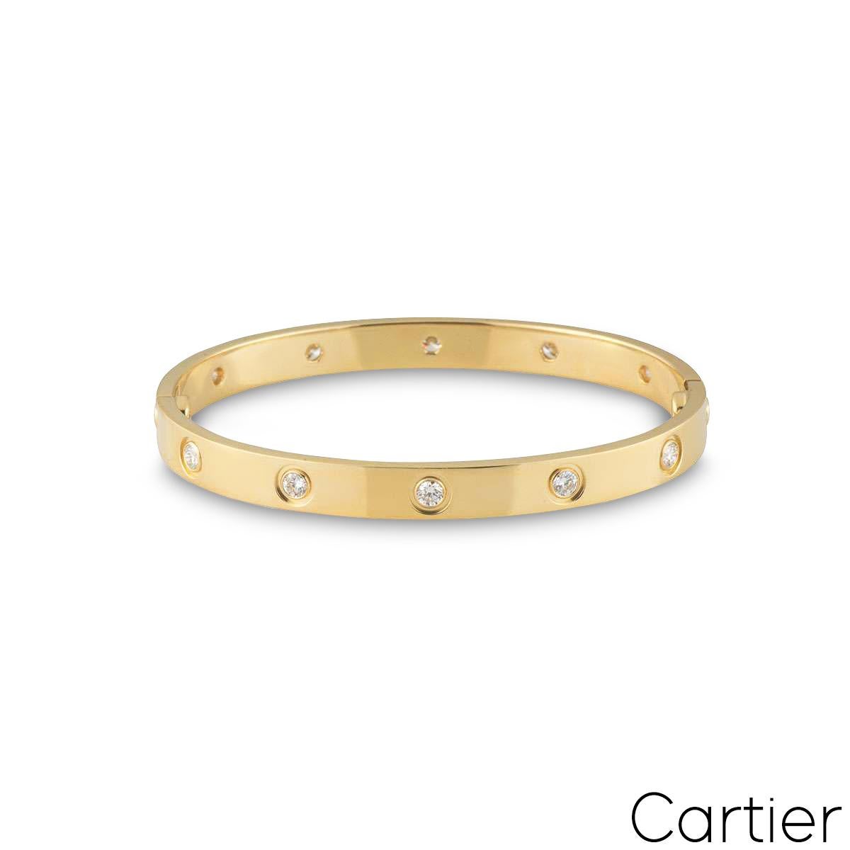 An 18k yellow gold full diamond Cartier bracelet from the Love collection. The bracelet is set with 10 round brilliant cut diamonds circulating the outer edge throughout in a rubover setting. The bracelet is size 17 and features the new style screw