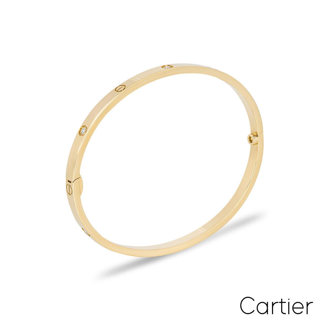 A Cartier 18k Yellow Gold Half Diamond SM Bracelet, from the Love collection. This slimmer version of the classic Love bracelet features Cartier's iconic screw motif design alternating with 6 round brilliant cut diamonds (~0.15ct) and a single screw