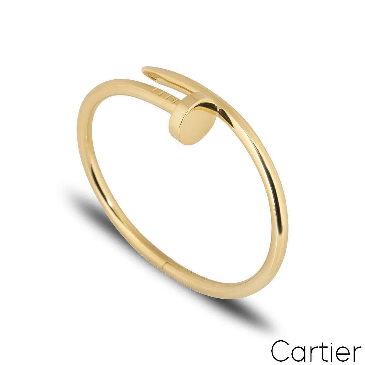An 18k yellow gold Juste un Clou bracelet from Cartier. The bracelet is wrapped around with a nail head at one end and the end of a nail at the other. A size 16, this bracelet features the new style clasp and has a gross weight of 31.4 grams.

Comes