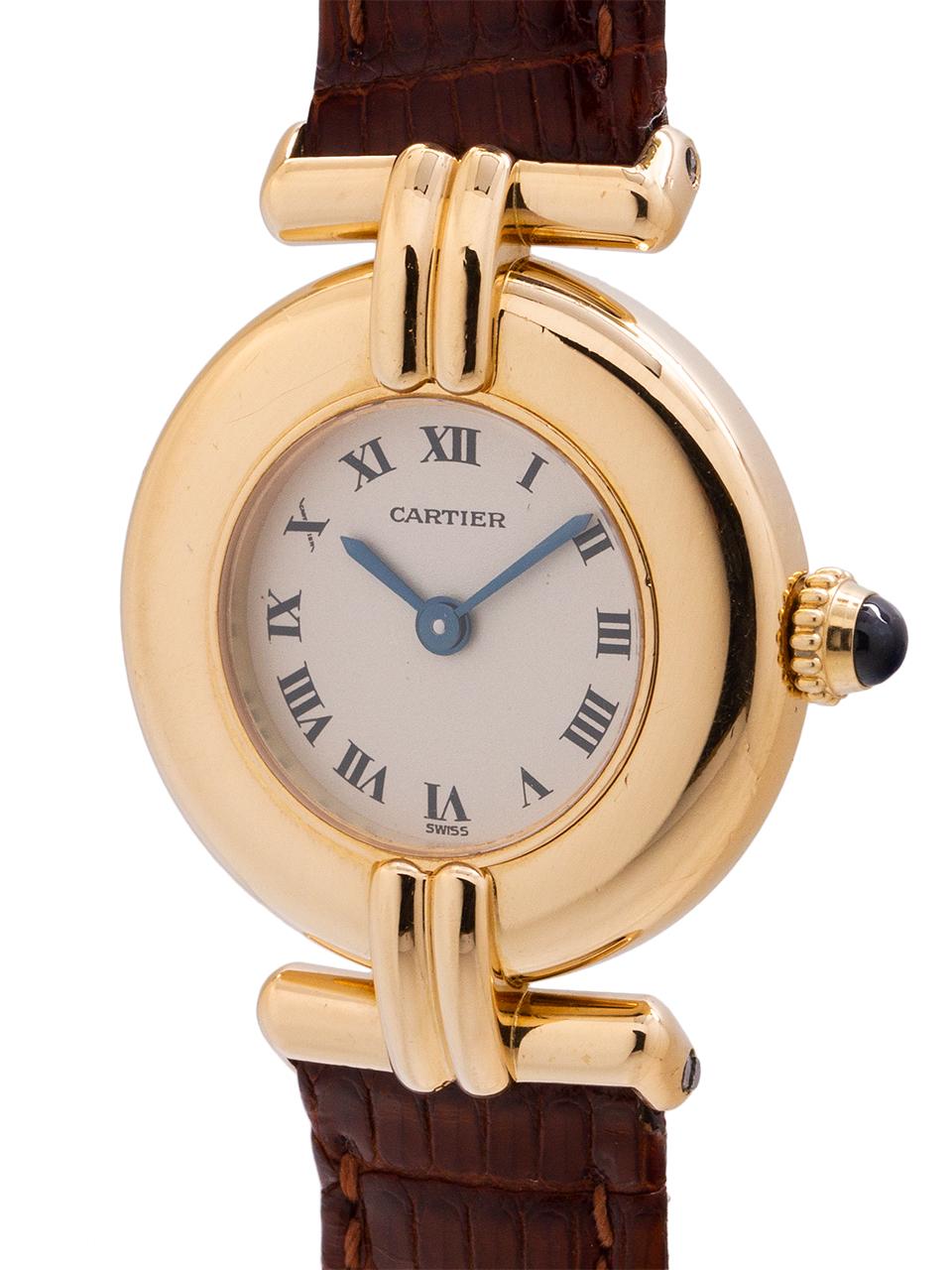 Cartier Lady Colisee 18K yellow gold circa 1990s. Featuring 23 x 31mm round case with wide dome bezel, sapphire crystal, silvered dial with black Roman figures. Battery powered quartz movement with cabochon sapphire crown. An attractive lady’s