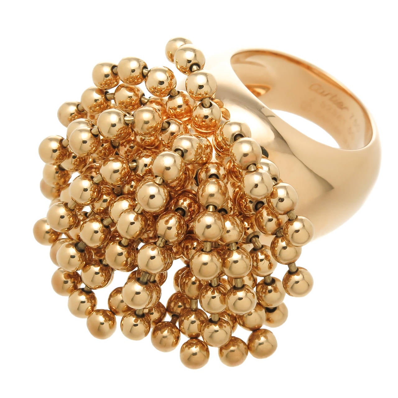 Circa 2000 Cartier 18K Yellow Gold Nouvelle Vague Perruque Ring, the top measures 1 3/8 inches in diameter,  Finger size 6 1/2 (53) European,  36.3 Grams in weight. A very unusual and very fun ring with great movement. Signed, Numbered. Original