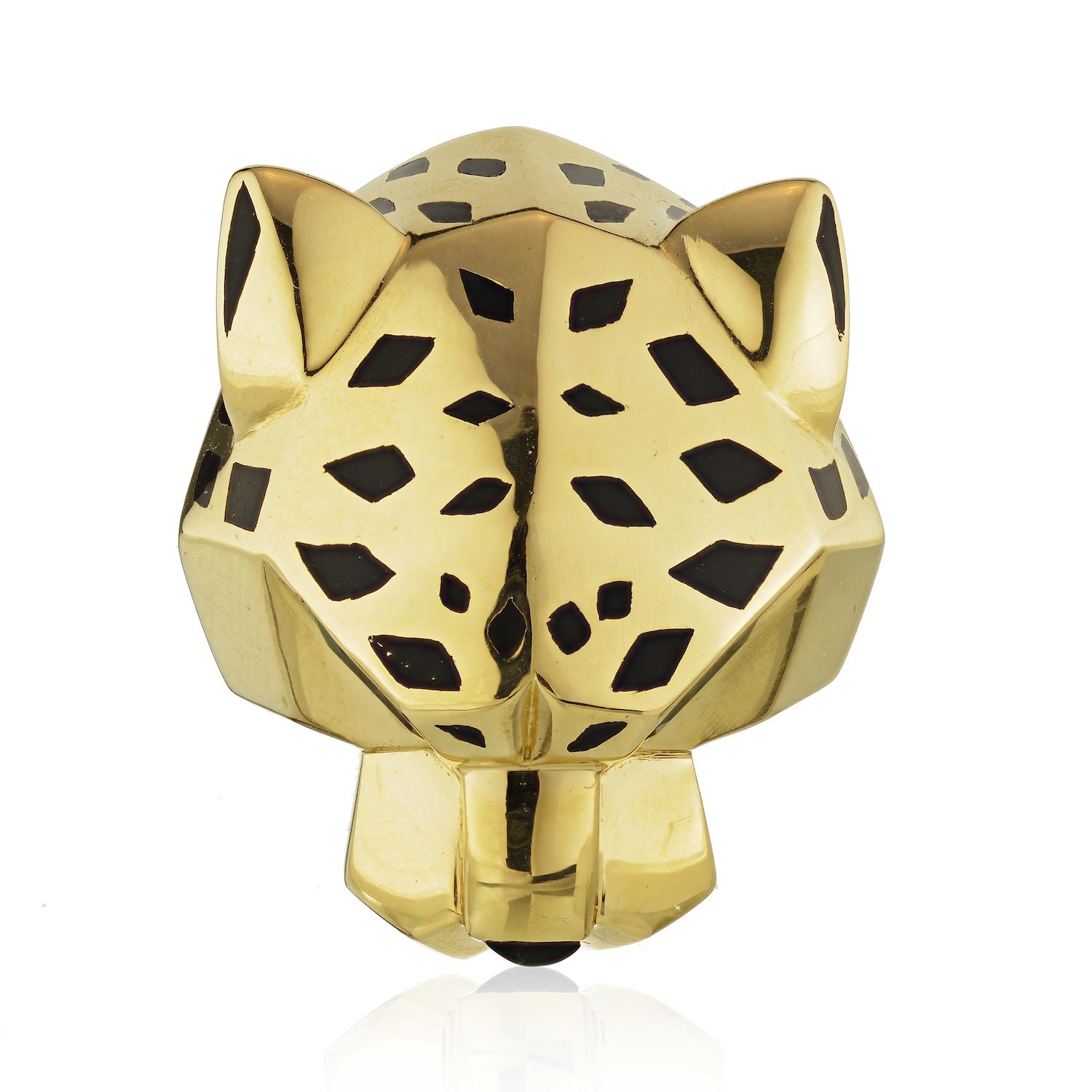 he emblematic panther has been an important part of Cartier's designs since 1914. This fiercely fashionable design from the Panthere de Cartier collection is made of 18K yellow gold and boasts an almost faceted look. The ring is covered with black