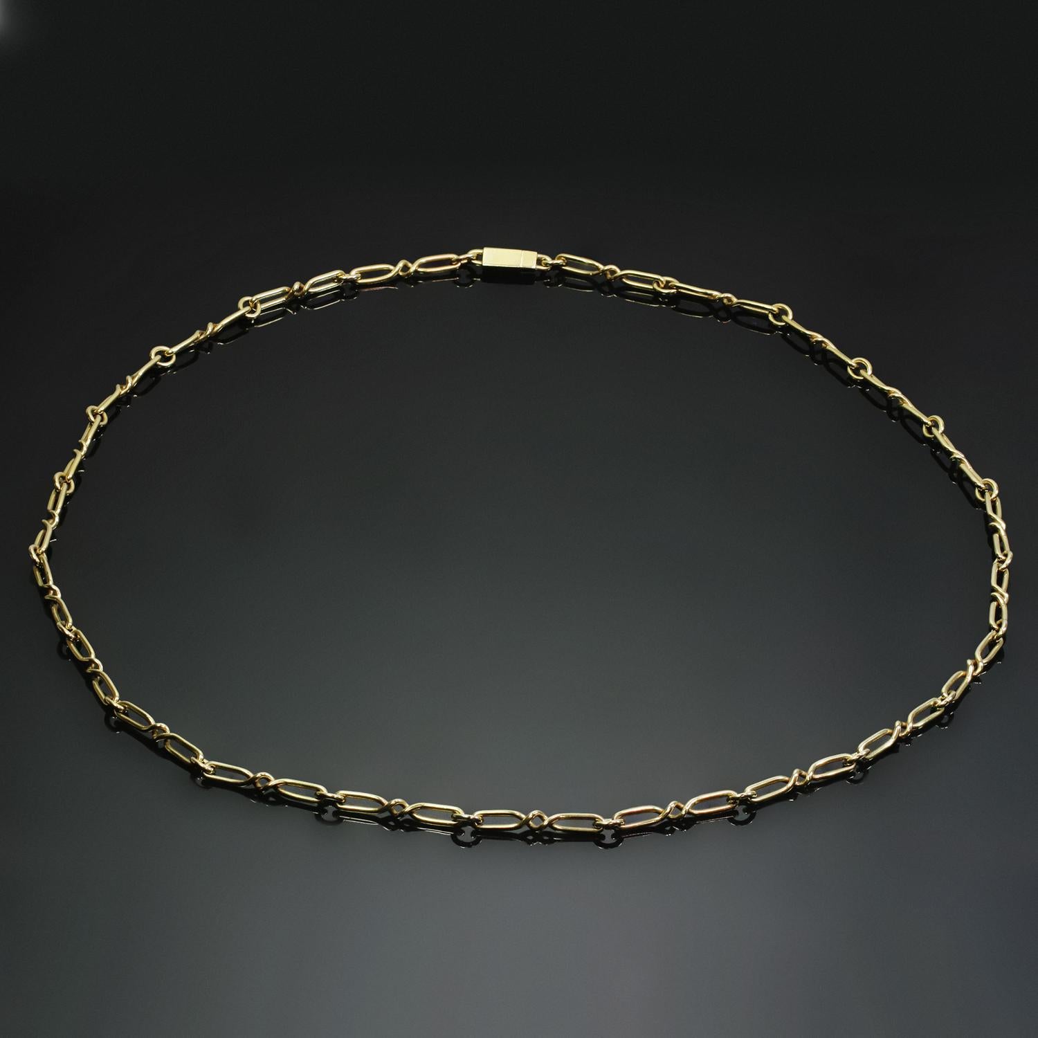 This unisex vintage Cartier necklace features a classic long open link chain design crafted in 18k yellow gold. Made in France circa 1970s. Measurements: 0.15