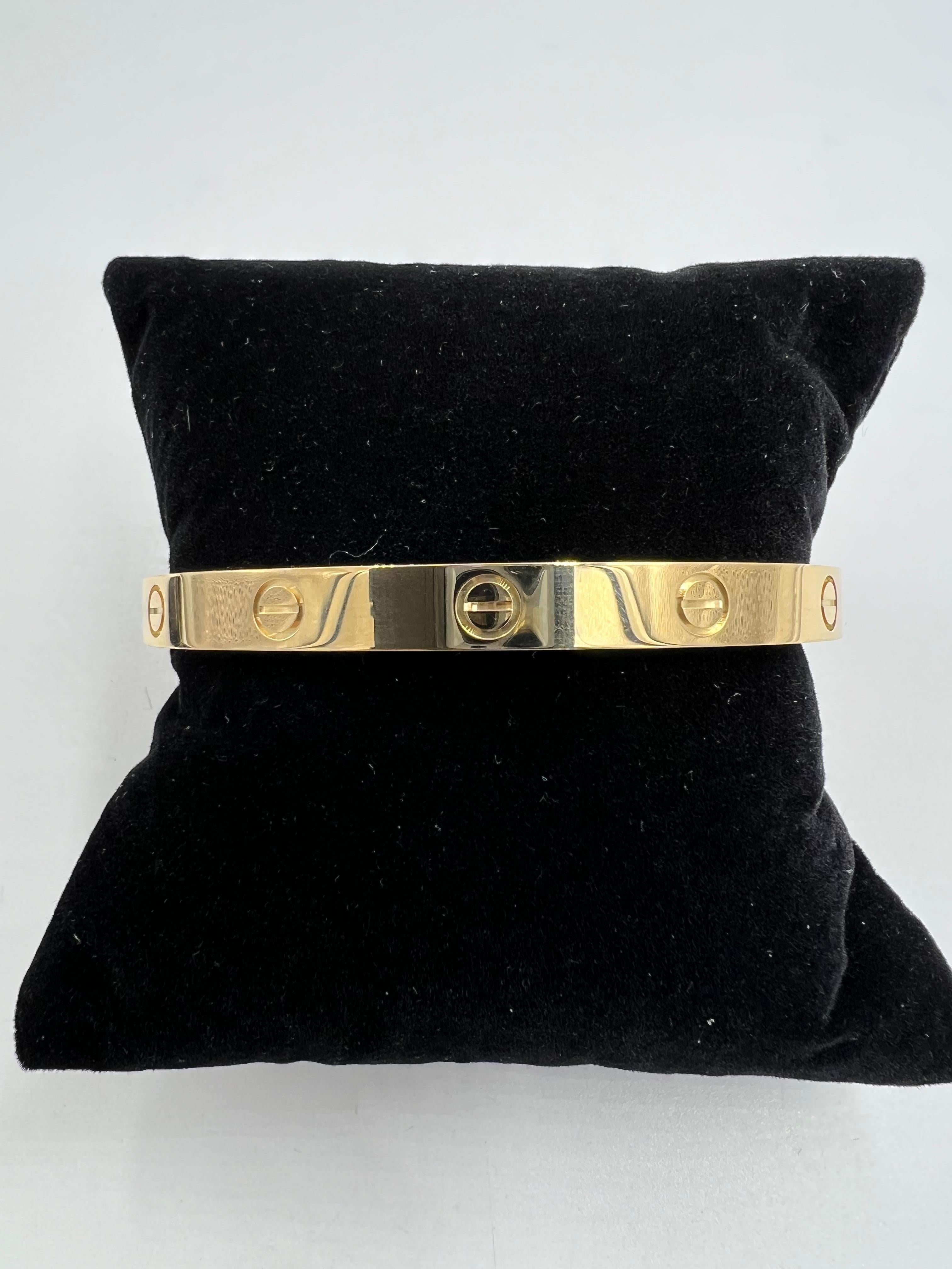 Cartier yellow gold Love Bracelet size 18, '2019.

This Cartier yellow gold bracelet is a size 18.  It is in great condition and comes with box and papers as well as July 2024 Cartier Service receipt. So basically, this bracelet is like brand new.

