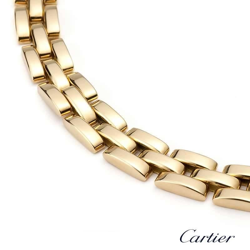 A classy 18k yellow gold Cartier necklace from the Maillon Panthere collection. The necklace comprises of 39 classic Cartier flat solid links placed like brickwork. The necklace measures 16.5 inches in length and features a box clasp with a push