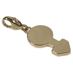 Pendentif en or jaune de Cartier avec symbole sexuel masculin