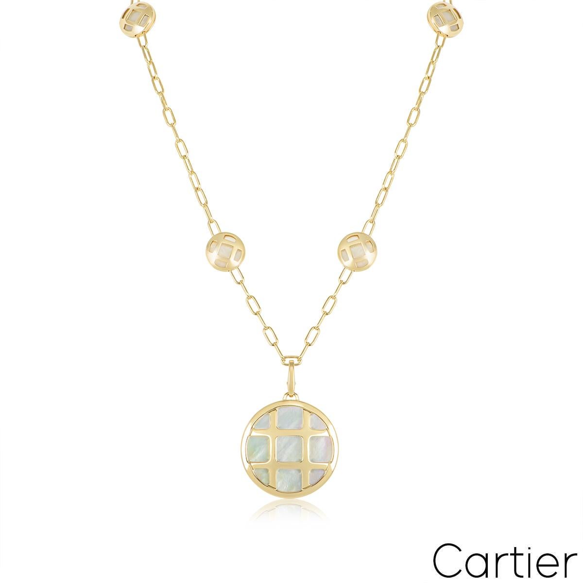 A beautiful 18k yellow gold jewellery suite by Cartier from the Pasha collection. The suite comprises of a detachable pendant, a necklace and a bracelet all featuring the iconic square grid design with a mother of pearl inlay set behind. The pendant