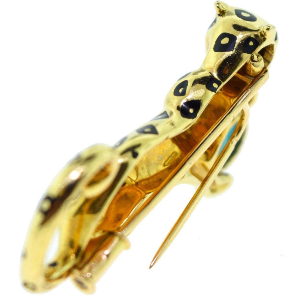 Show your fierce side with this Cartier panther pin. The iconic motif is crafted in high polish yellow gold with black enamel spots in a ferocious pose.

Length: 1.75 inches (approx.)
Height: 0.75 inches (approx.)
Fully hallmarked, Cartier serial