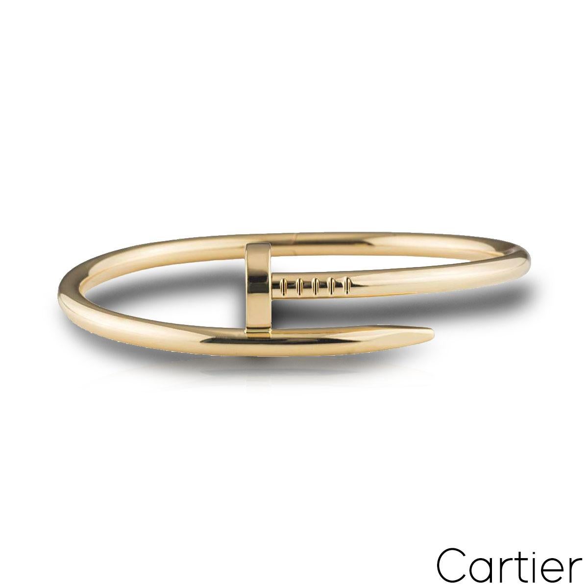 A stylish 18k yellow gold bracelet by Cartier from the Juste Un Clou collection. The bracelet is wrapped around with a nail head at one end and a nail end at the other. The bracelet is a size 17 with the old style clasp fitting and has a gross