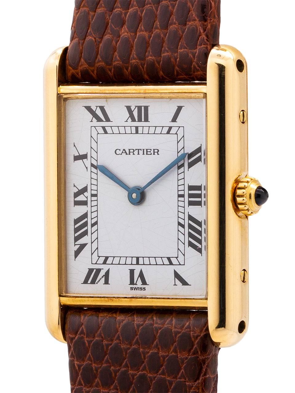 
Cartier Man’s 18K gold Tank Louis circa 1979’s. Featuring 24 X 30mm case secured by 4 screws. Classic early silvered and finely grained original dial signed Cartier with black roman numerals and blued steel hands and signed SWISS. Powered by a
