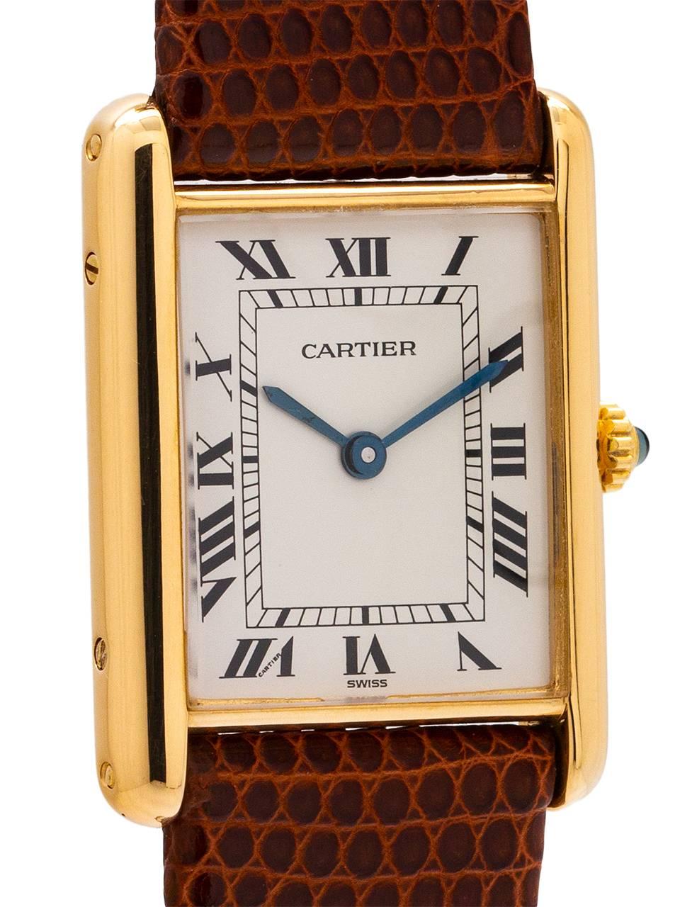 
Cartier Man’s Tank Louis 18K YG circa 1990s. Featuring 24 x 30mm 18K yellow gold case secured by 4 side and 4 case back screws. Featuring classic white Cartier dial, signed Must de Cartier with printed black Roman numerals and blued steel hands.