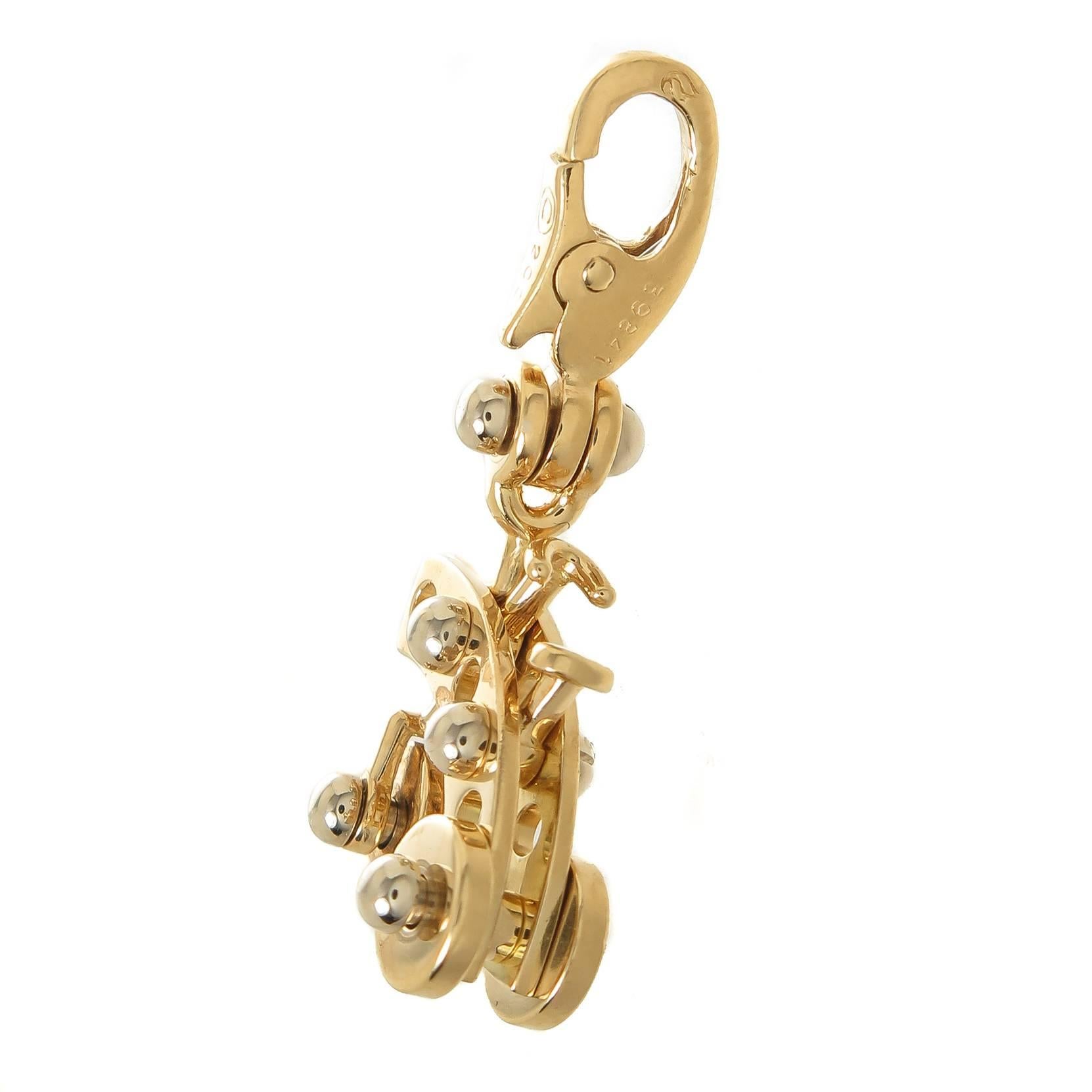 Circa 2000 Cartier 18K Yellow Gold Tricycle Charm, measuring 3/4 inch in length X 1/2 inch and having a Lobster Claw Clasp so the Charm can be easily taken on and off so it can be worn on a Bracelet or Necklace. 