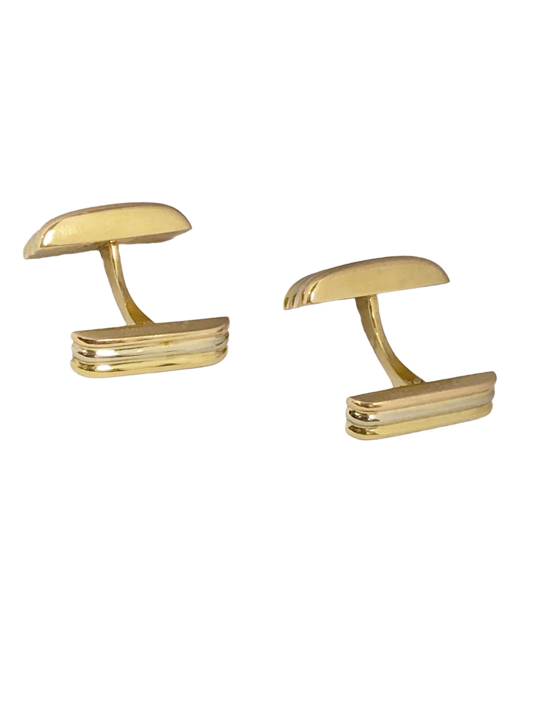 Circa 1990 Cartier Trinity collection 18k Yellow Gold Cufflinks, the tops measure 5/8 x 5/16 inch. having hinged toggle style backs for easy on and off. Signed and n numbered, come in original Cartier Travel pouch.