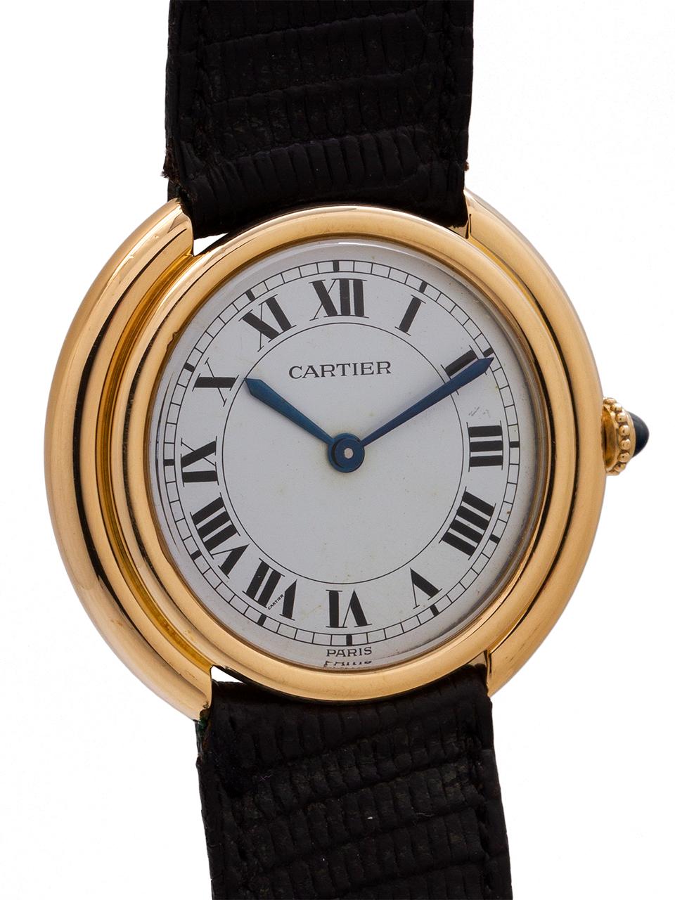 Men's Cartier 18K gold “Vendome tank” circa 1970’s. Featuring a 27 x 32mm round case with rounded stepped case design. Featuring white gloss dial with classic Cartier Roman figures, blued steel hands, and powered by 17 jewel manual wind movement