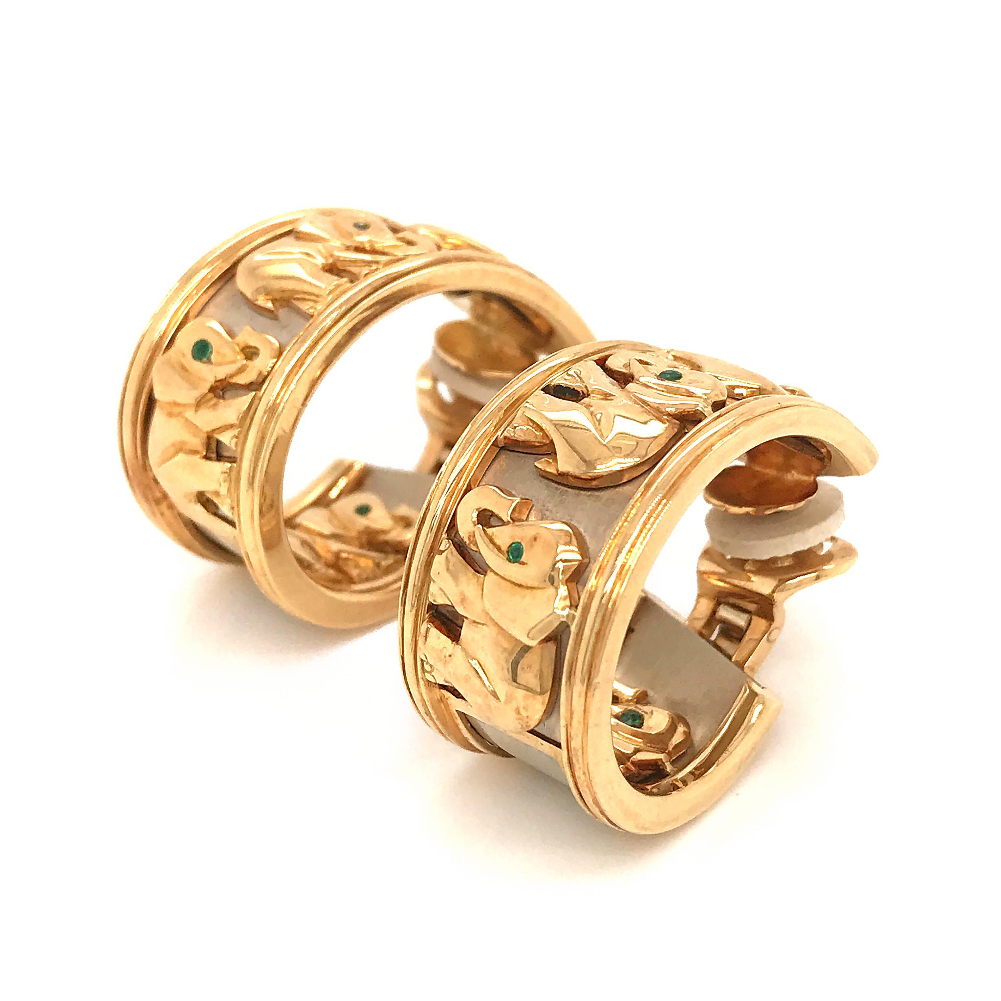 Gorgeous Vintage Cartier 18KT Yellow Gold Elephant Hoop Earrings Earrings weigh 47 grams.
Earrings contain green emeralds set as eyes.
Earrings contain no posts, but we can have some put on.
Earrings are 1 1/4 inches in length and in between 1/2 and