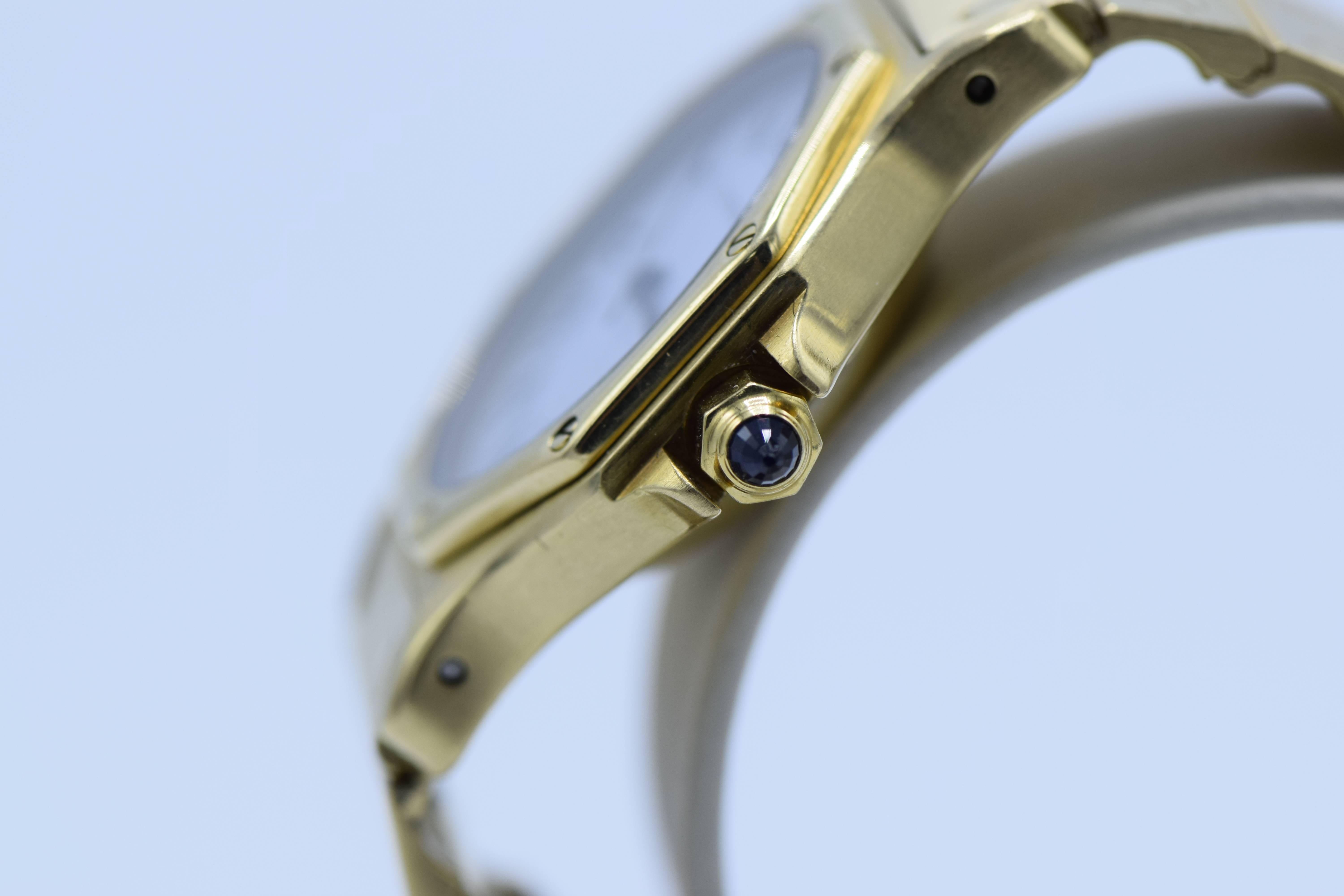 18k yellow gold octagonal case and bracelet, white dial, 

signed, marked with black Roman numerals, date aperture at 3, black steel hands 

Blue Sapphire 

Working condition; Automatic 
