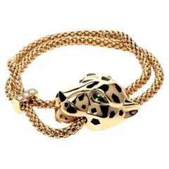 Cartier - Bracelet tête de panthère jaune, maille tachetée, yeux d'émeraude