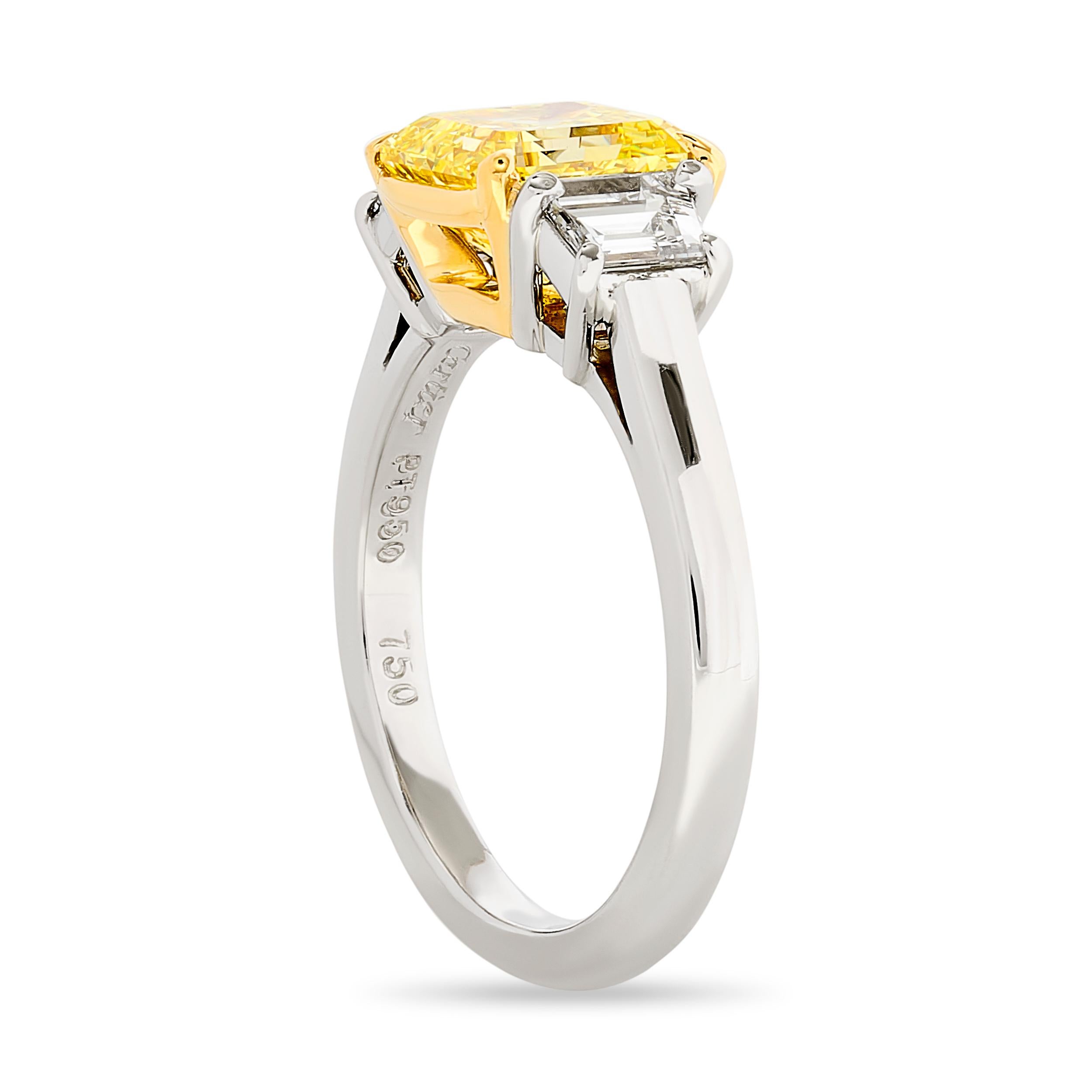 Golden Glow: Embrace the brilliance of this Cartier 3 stone diamond ring featuring a Fancy Intense Yellow square emerald cut diamond at its heart.

Made in platinum and 18k yellow gold, this ring has:
1 square emerald cut that weighs ~2.01 carat and