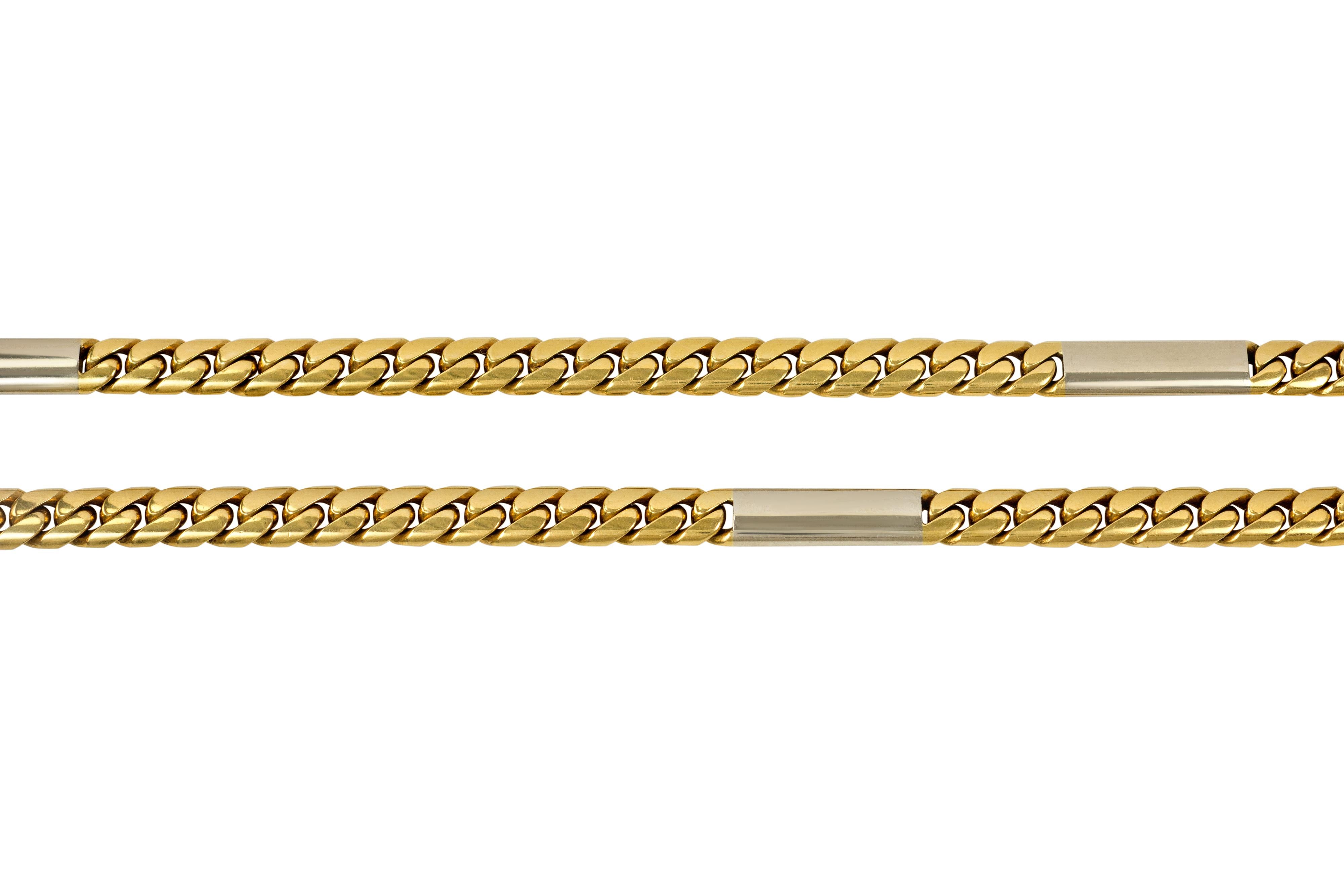An 18 karat gold link chain, by Cartier. The design features yellow gold curb links, interspersed with 4 white gold I.D. bars. The bars would make an excellent surface for engraving.

Chain is signed Cartier and numbered 54520.