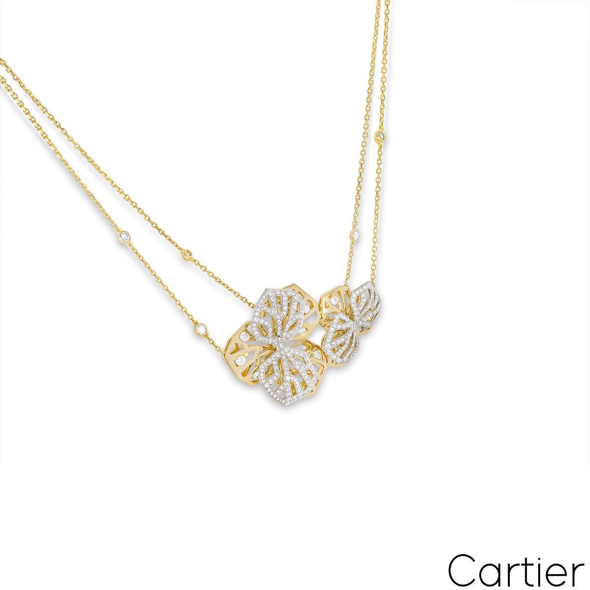 A magnificent 18k yellow and white gold diamond necklace by Cartier from the Caresse d’Orchidées collection. The necklace features two diamond set openwork orchid motifs centred on a double chain with 5 bezel set diamond stations. Set throughout the