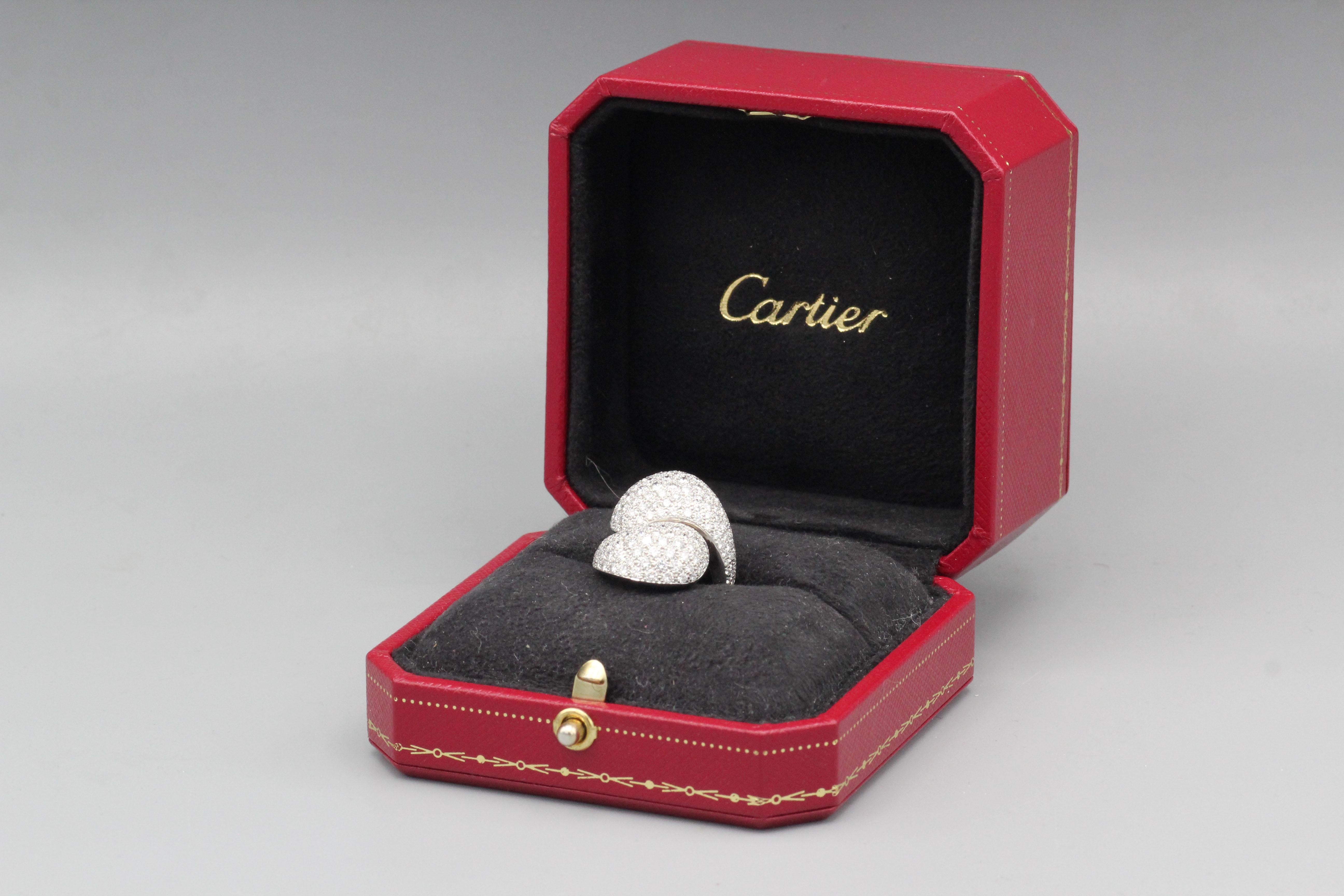 This pave diamond 18 karat white gold Yin Yang ring is a stunning piece of fine jewelry crafted by Cartier, a world-renowned luxury brand known for its exceptional quality and attention to detail.  The ring is made of 18 karat white gold, which is a