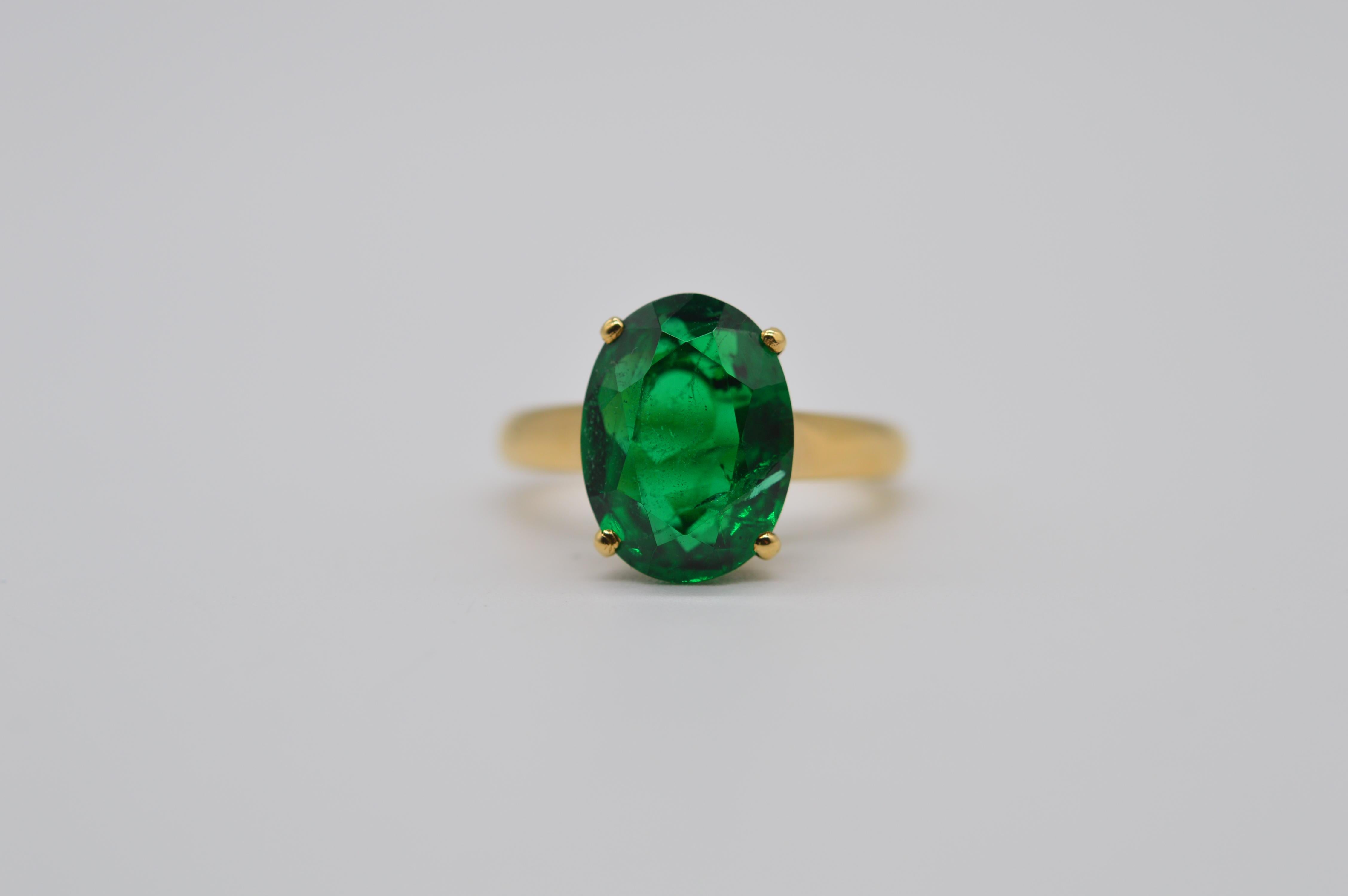 A stunning Zambian Oval Emerald 4.99 carats ring Unworn
Mounted in an 18K Yellow Gold ring signed by 