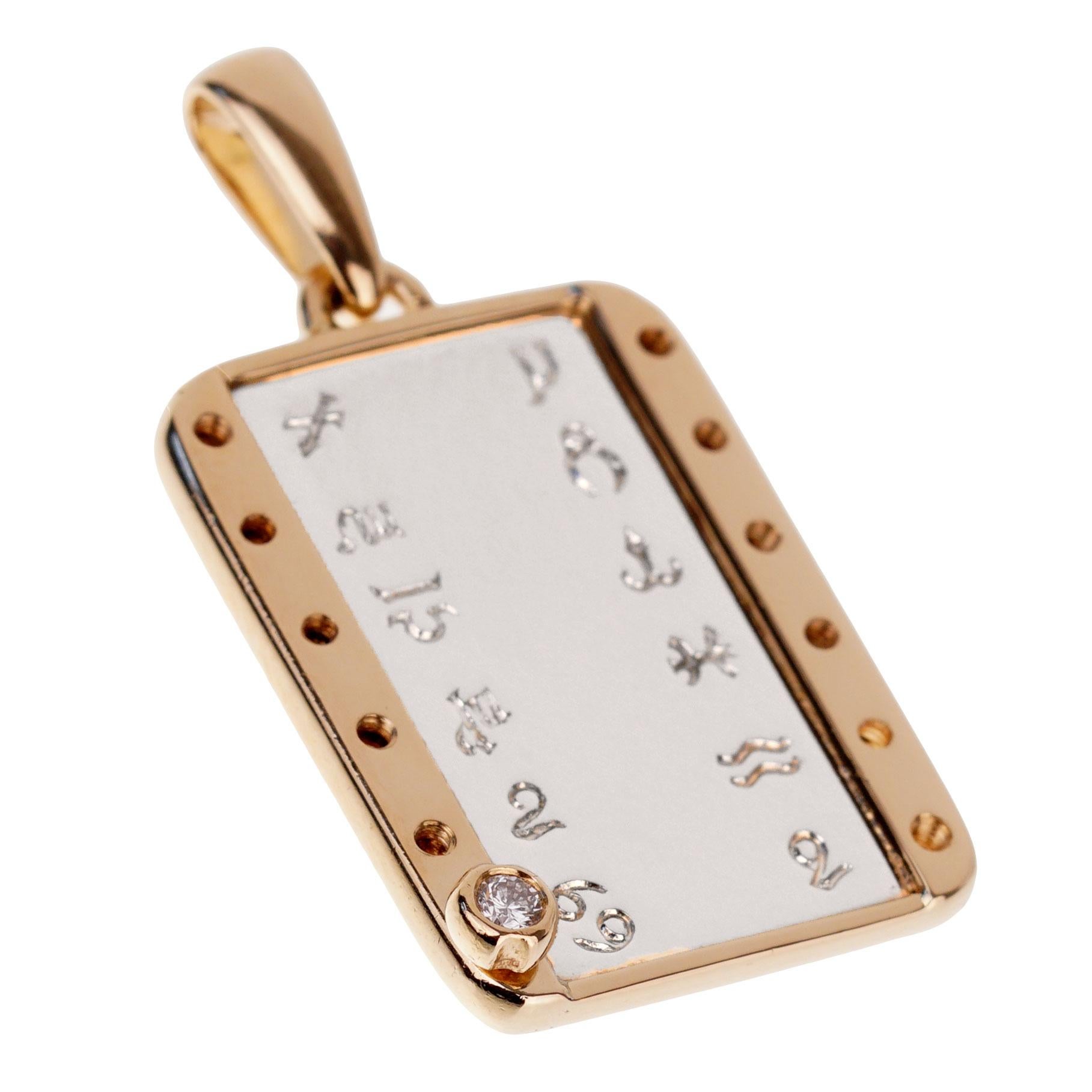 An iconic Cartier zodiac pendant featuring a removable diamond screw to set on your zodiac sign. The pendant white 18k white and yellow gold and has just been polished by Cartier, and will arrive in as new condition.

The pendant measures 1.25