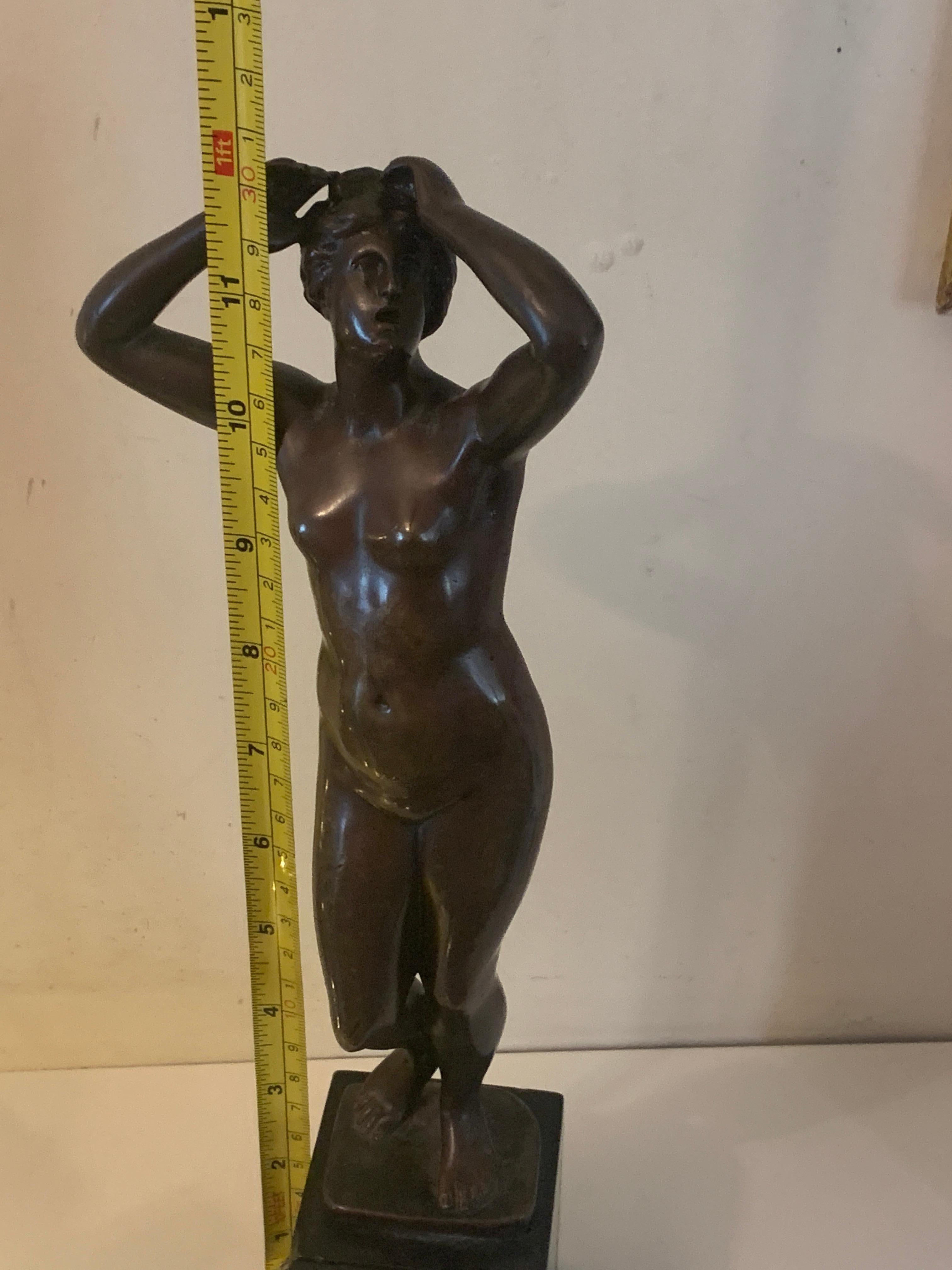 Well modeled 19th century French bronze of a standing naked woman. 

Signed Cartinet, this piece is a wonderful example of the skill of a Sculptor.

The piece retains all its original patination and it has no restoration.

The bronze sits on a black