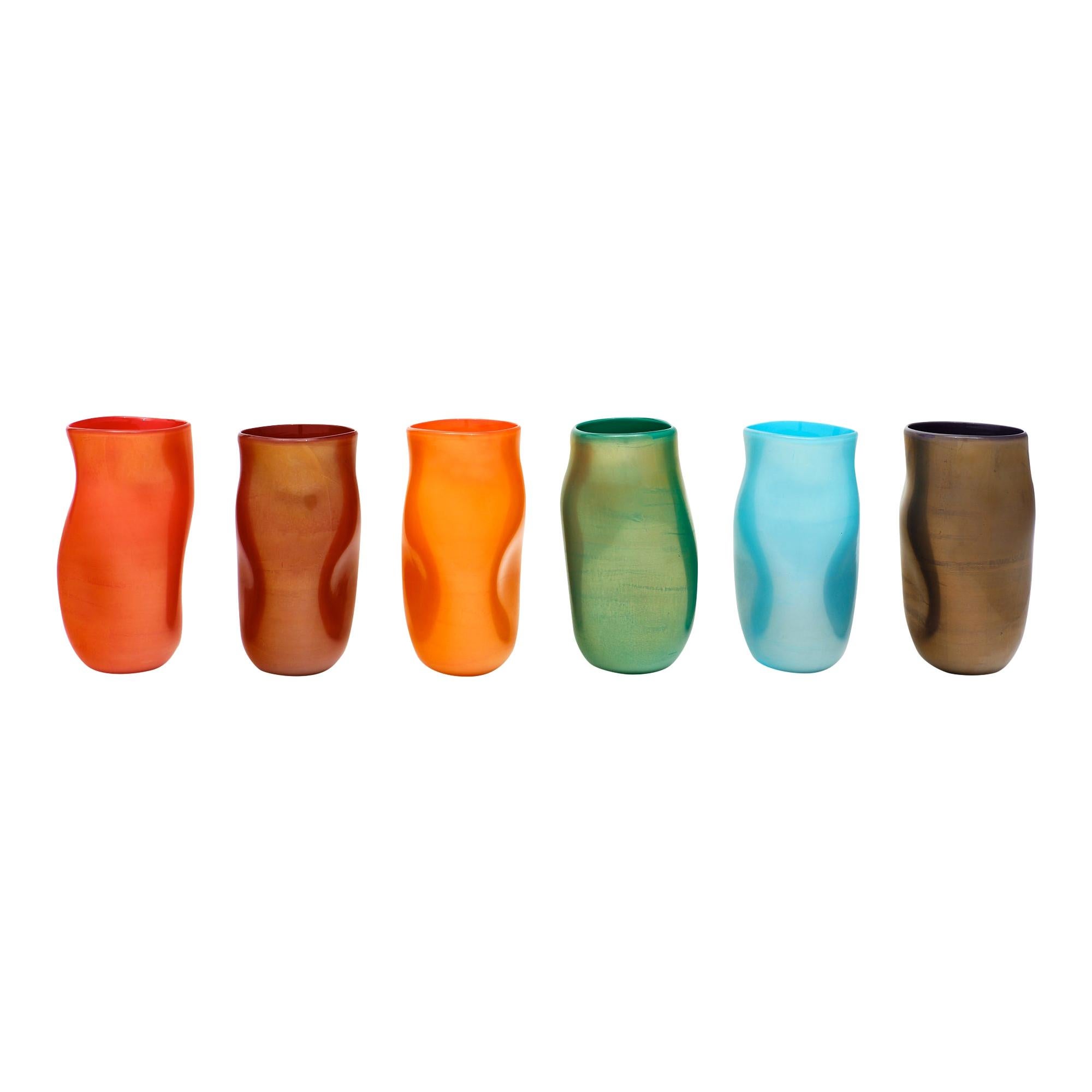 A collection of Murano glass “Cartoccio” vases. Originally six vases, now there are three available (orange, green, purple). These three “Cartoccio” (meaning paper glass) vases in various colors from the studio of Alberto Dona (signed), a “maestro