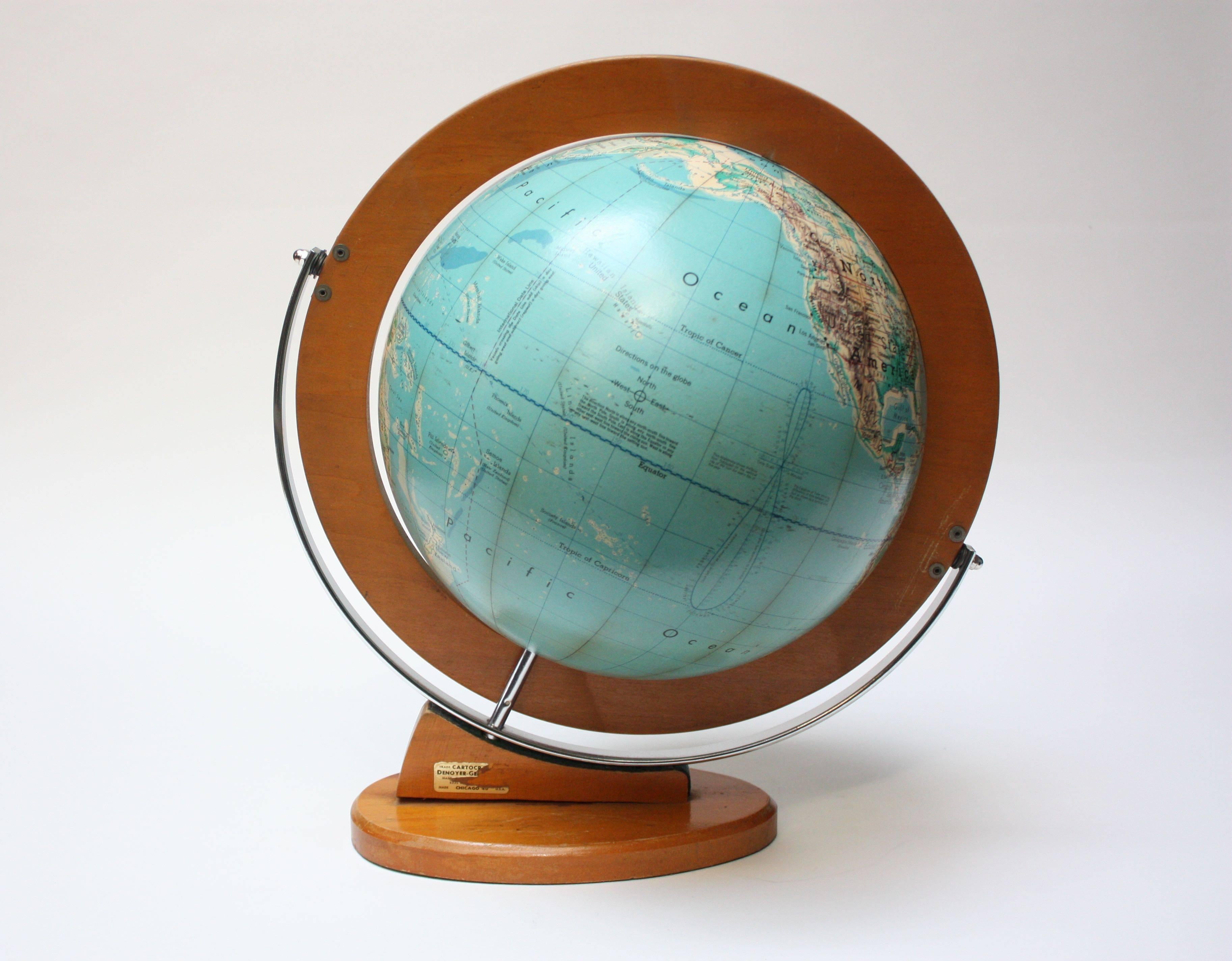 Denoyer-Geppert Co. of Chicago, IL 'Cartocraft 12 inch Visual Relief Globe' composed of paper gores over plastic, featuring the basic details of a student demonstration globe: International Date Line, Ecliptic and analemma. Adjustable, wood horizon