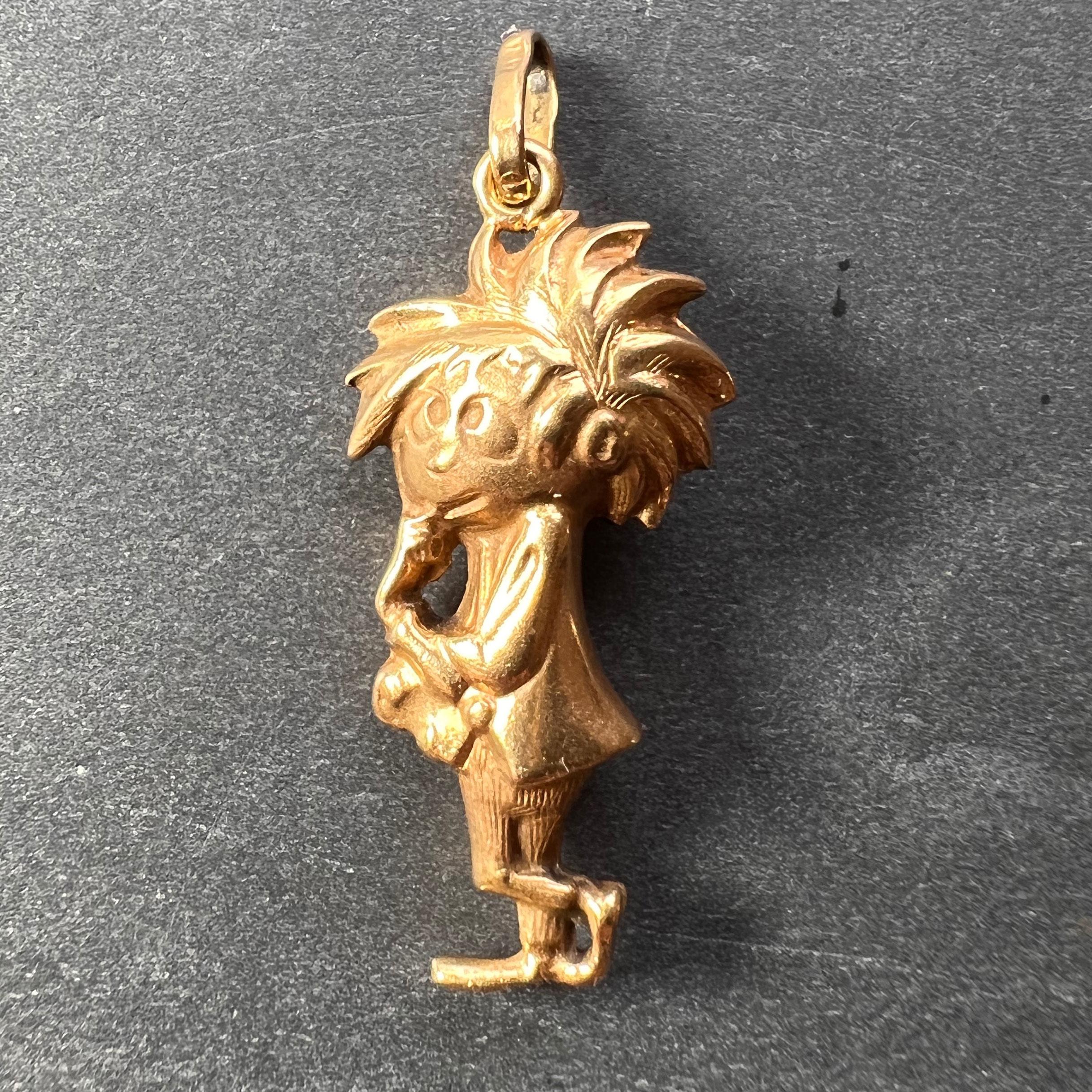 An 18 karat (18K) yellow gold charm pendant designed as a cartoon character. Stamped 750 for 18 karat gold to the jump ring.
 
Dimensions: 2.8 x 1.3 x 0.7 cm (not including jump ring)
Weight: 2.37 grams
 (Chain not included)