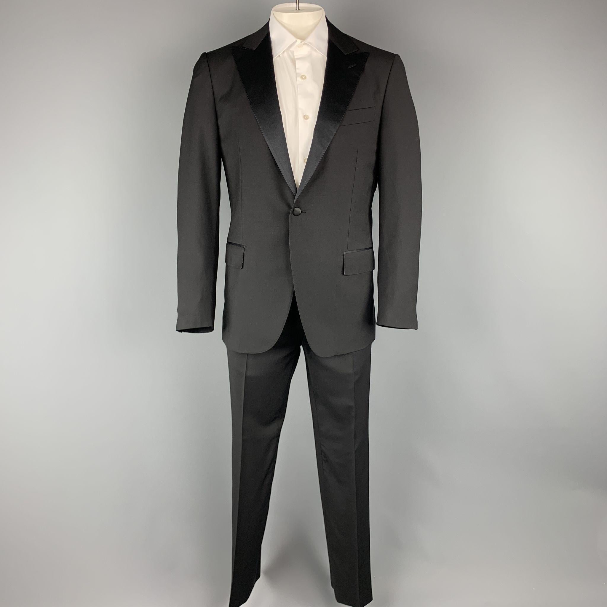 
CARUSO for NEIMAN MARCUS suit comes in a black wool and mohair and includes a single breasted,  single button sport coat with peak lapel and matching front trousers.
 
Excellent Pre-Owned Condition.
Marked: 52
 
Measurements:
 
-Jacket

   