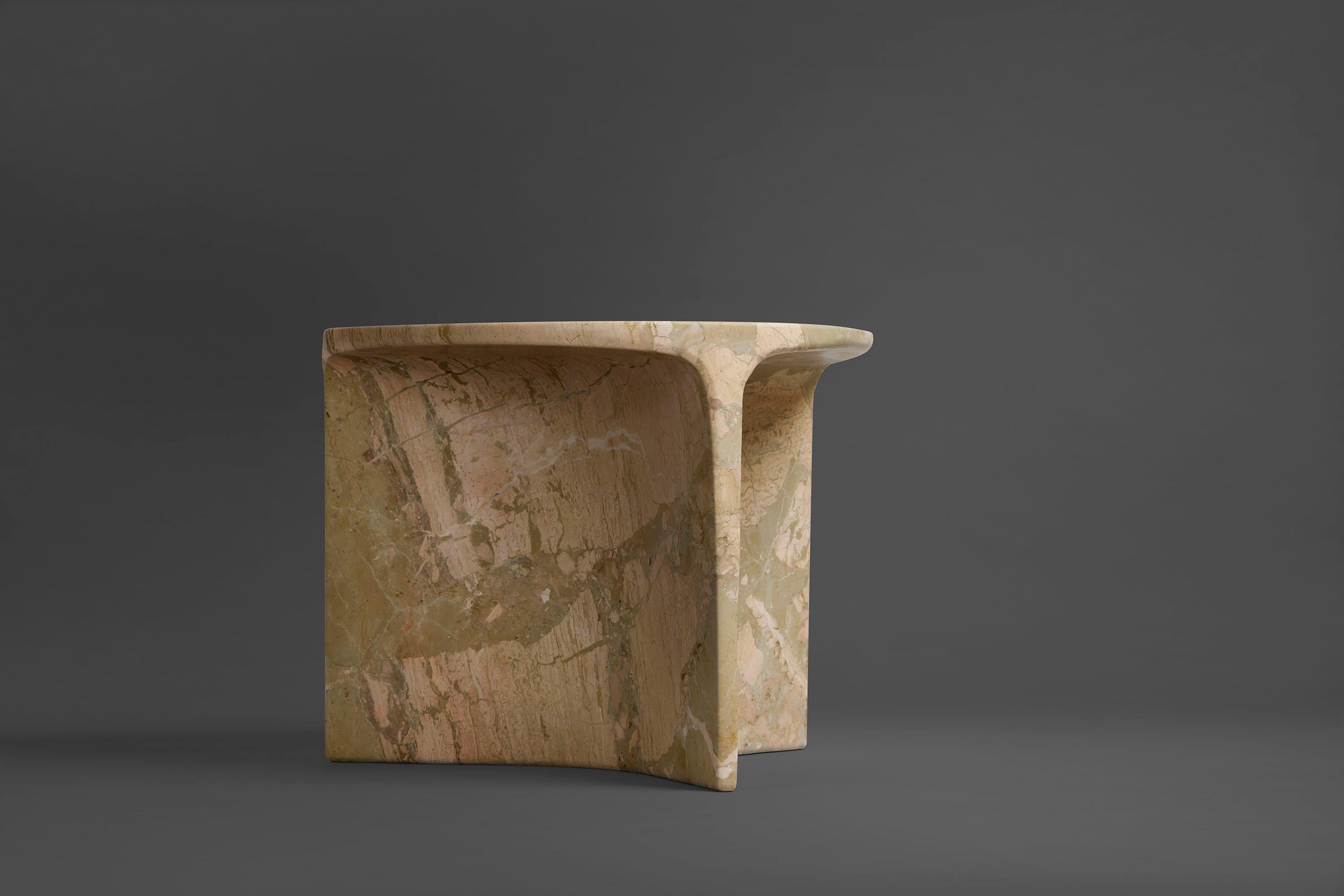 Carv occasional table is Cut from a single block of Italian Ceppo Monet marble.
Essential and organic design, naturally creating a flat tabletop flowing
to a Y - shaped foot, revealing the stone’s veins
from the exterior surface through to it’s