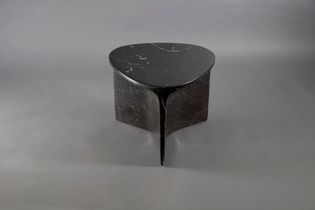 Carv occasional table is Cut from a single block of Italian Carrara marble.
Essential and organic design, naturally creating a flat tabletop flowing
to a Y - shaped foot, revealing the stone’s veins
from the exterior surface through to it’s