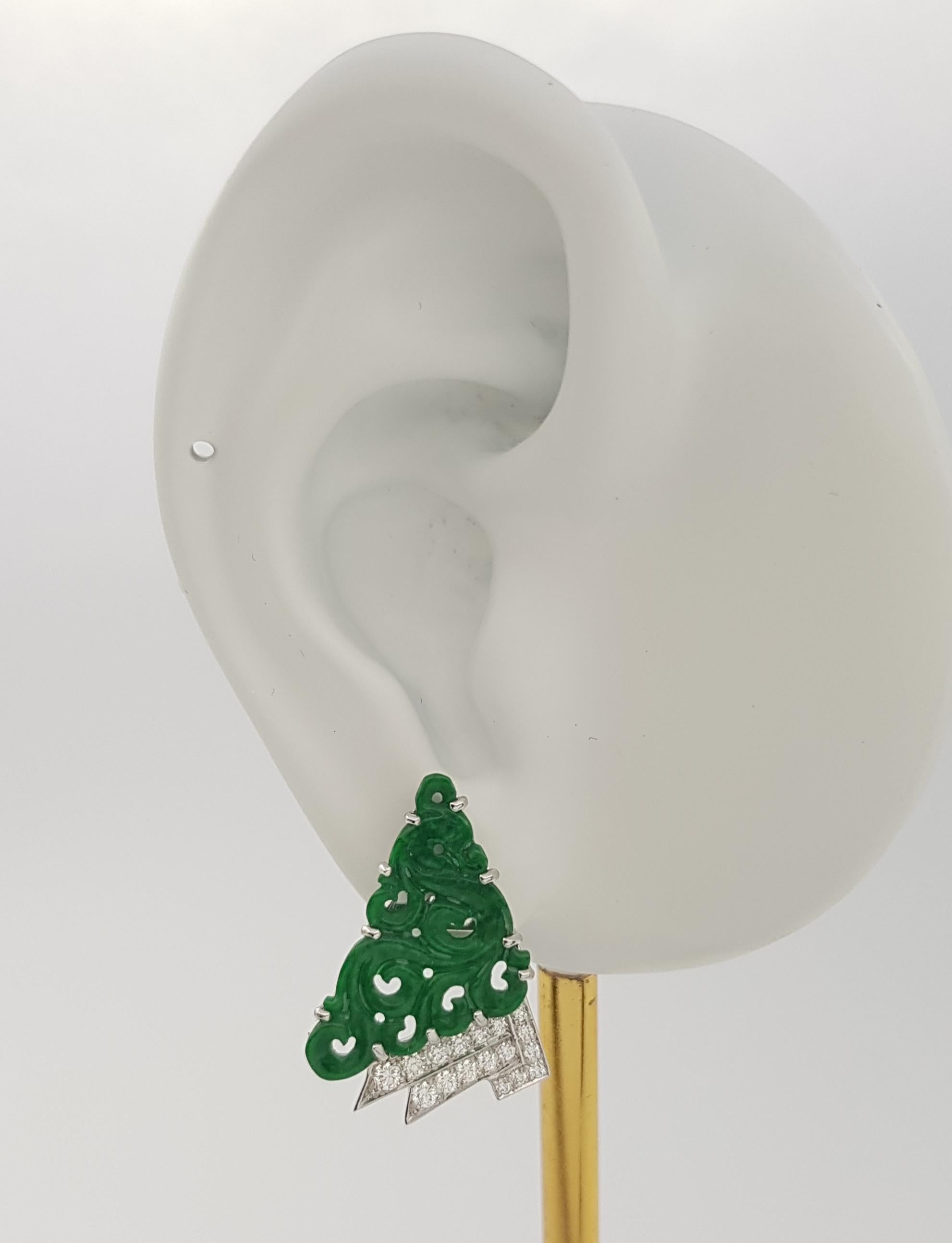 Jade 4.04 carats with Diamond 0.38 carat Earrings set in 18K White Gold Settings

Width: 1.6 cm 
Length: 2.3 cm
Total Weight: 8.24 grams

