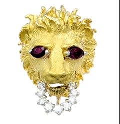 Carved 18 Karat Yellow Gold Lion Head Ring with Ruby Eyes and Diamond Bit