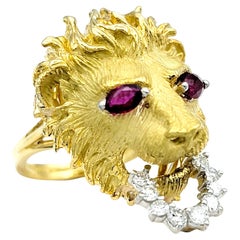 Carved 18 Karat Yellow Gold Lion Head Ring with Ruby Eyes and Diamond Bit