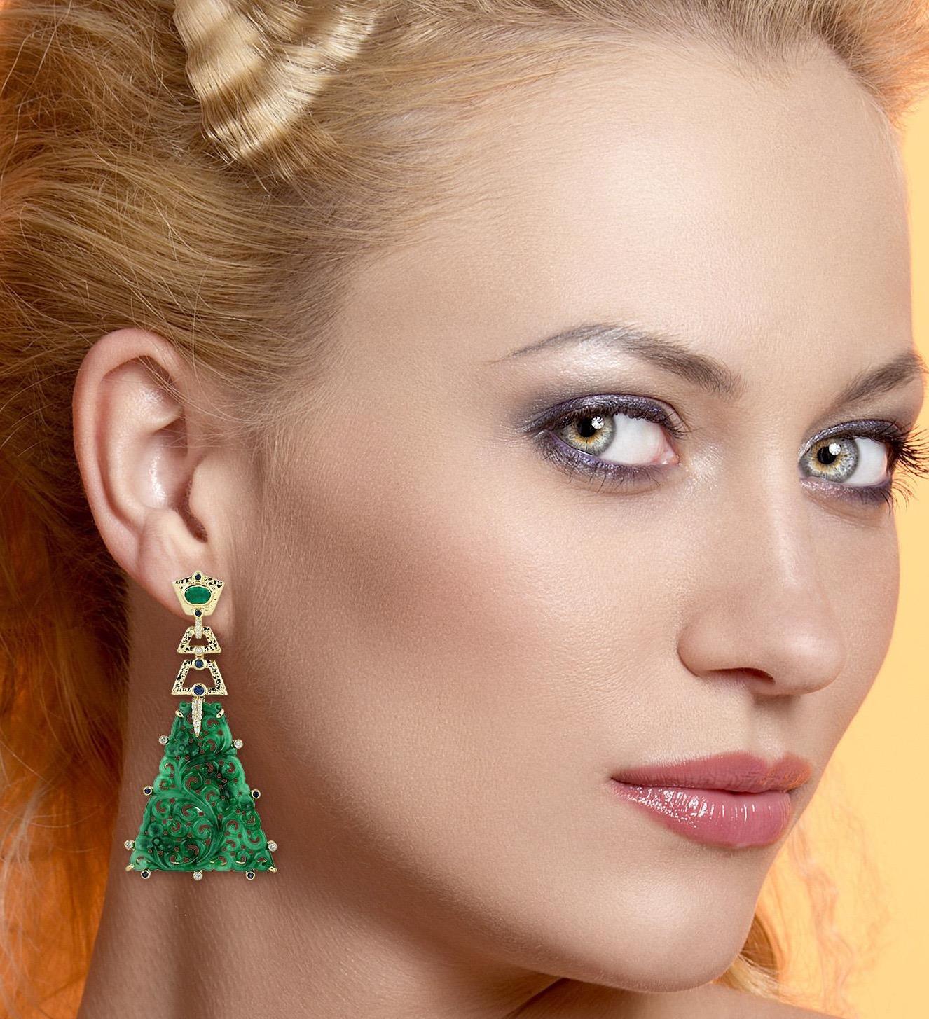 Handcrafted from 18-karat gold, these stunning earrings are set with 32.92 carats of carved Jade, 0.90 carats emerald, .53 carats sapphire and .38 carats sparkling diamonds.

FOLLOW  MEGHNA JEWELS storefront to view the latest collection & exclusive