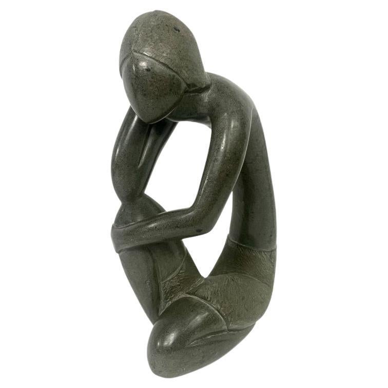 Carved Abstract Stone Sculpture Of A Figure In Thinking Position