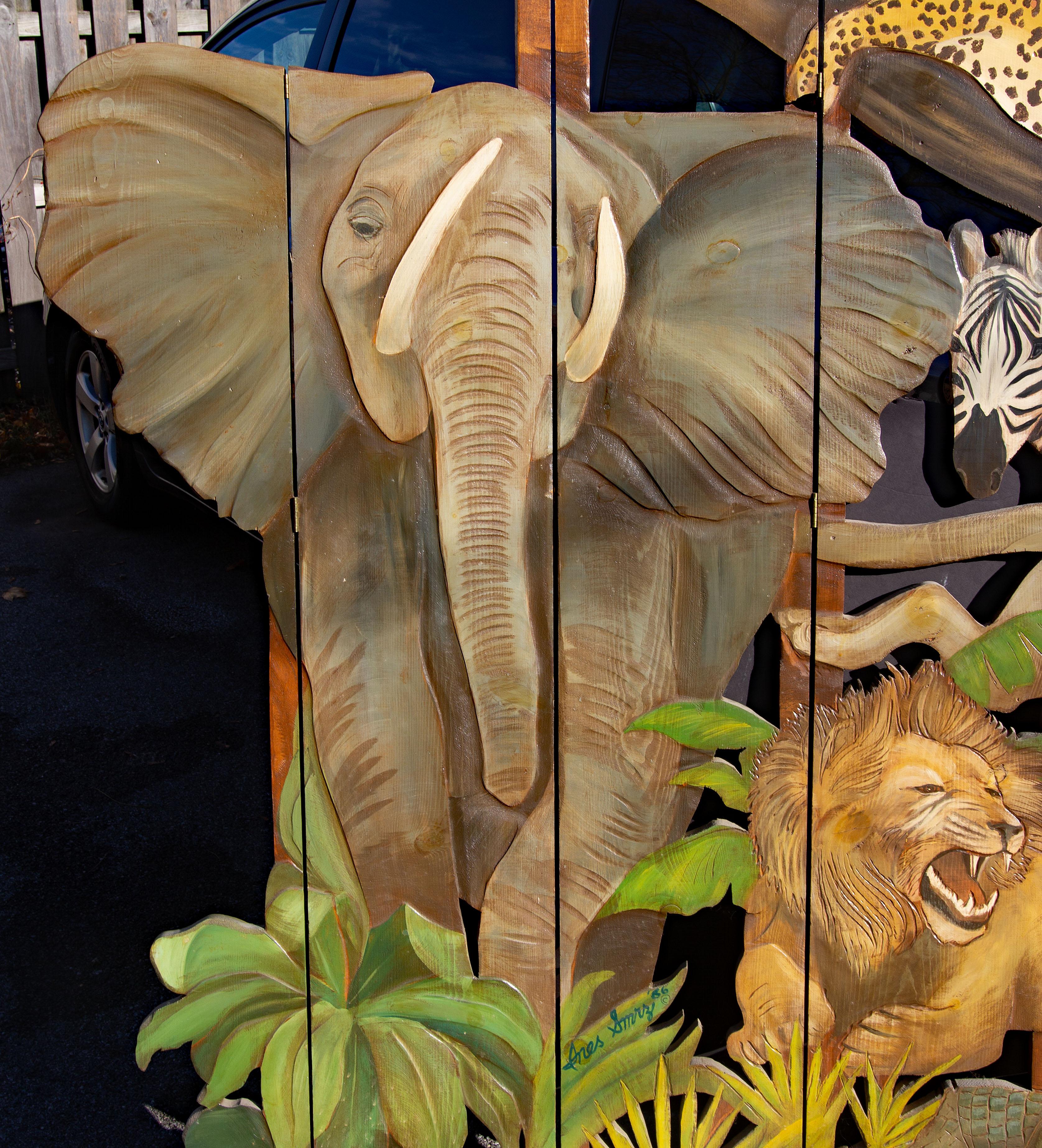 Exotic African jungle screen. Hand painted and carved solid wood panels. Signed Ines Smrz. Dated 1986. Shipping as low as $350. Contact Joseph Dasta Antiques for a quote.