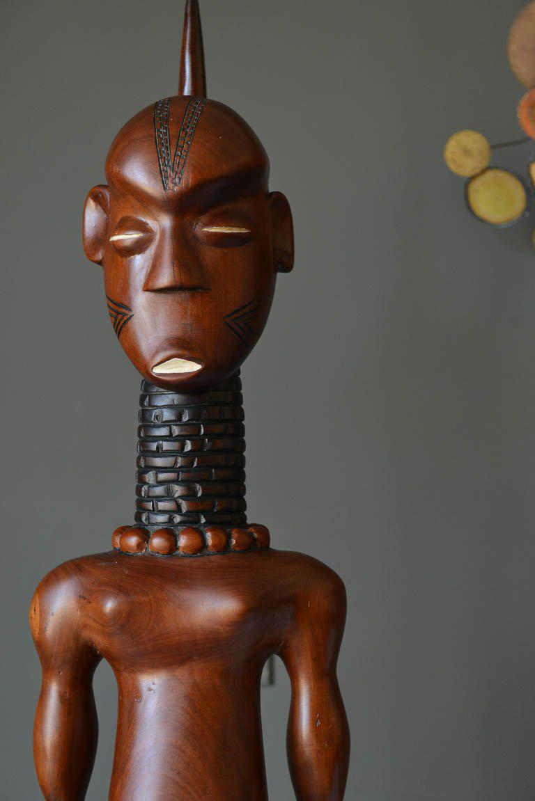 Carved African Male Statue, Kenya, circa 1967. Includes original photograph with owner who traveled to Kenya often. Hand carved ebony.

Measures