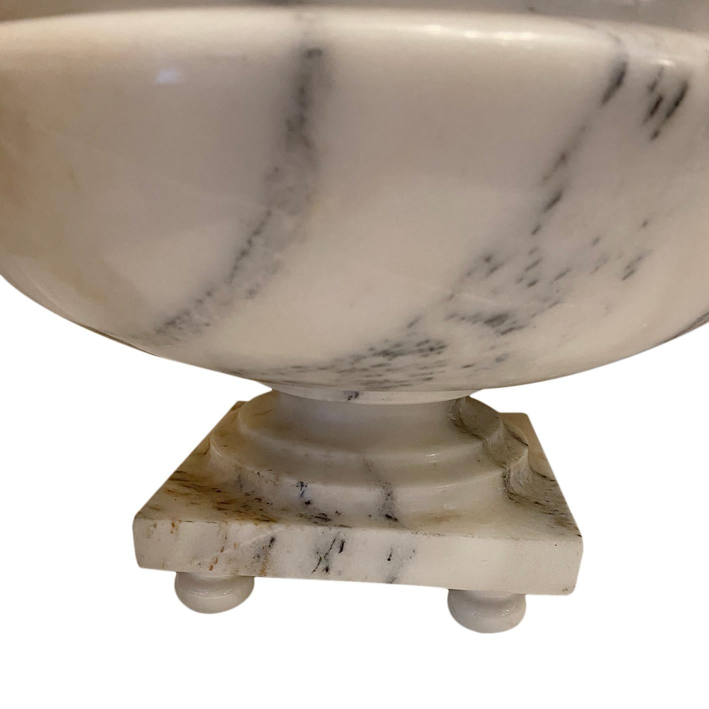 A pair of circa 1930's Italian carved alabaster pedestal 'fruit bowl' table lamps. These can also be modified as decorative objects without the lamp stem.

Measurements:
Height of body: 18
