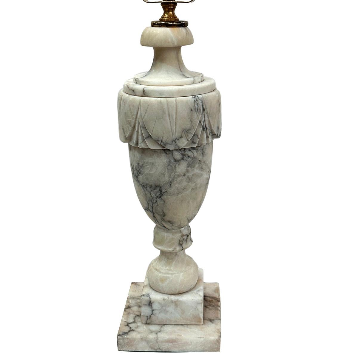 A circa 1950's Italian carved alabaster lamp.

Measurements:
Height of body: 16