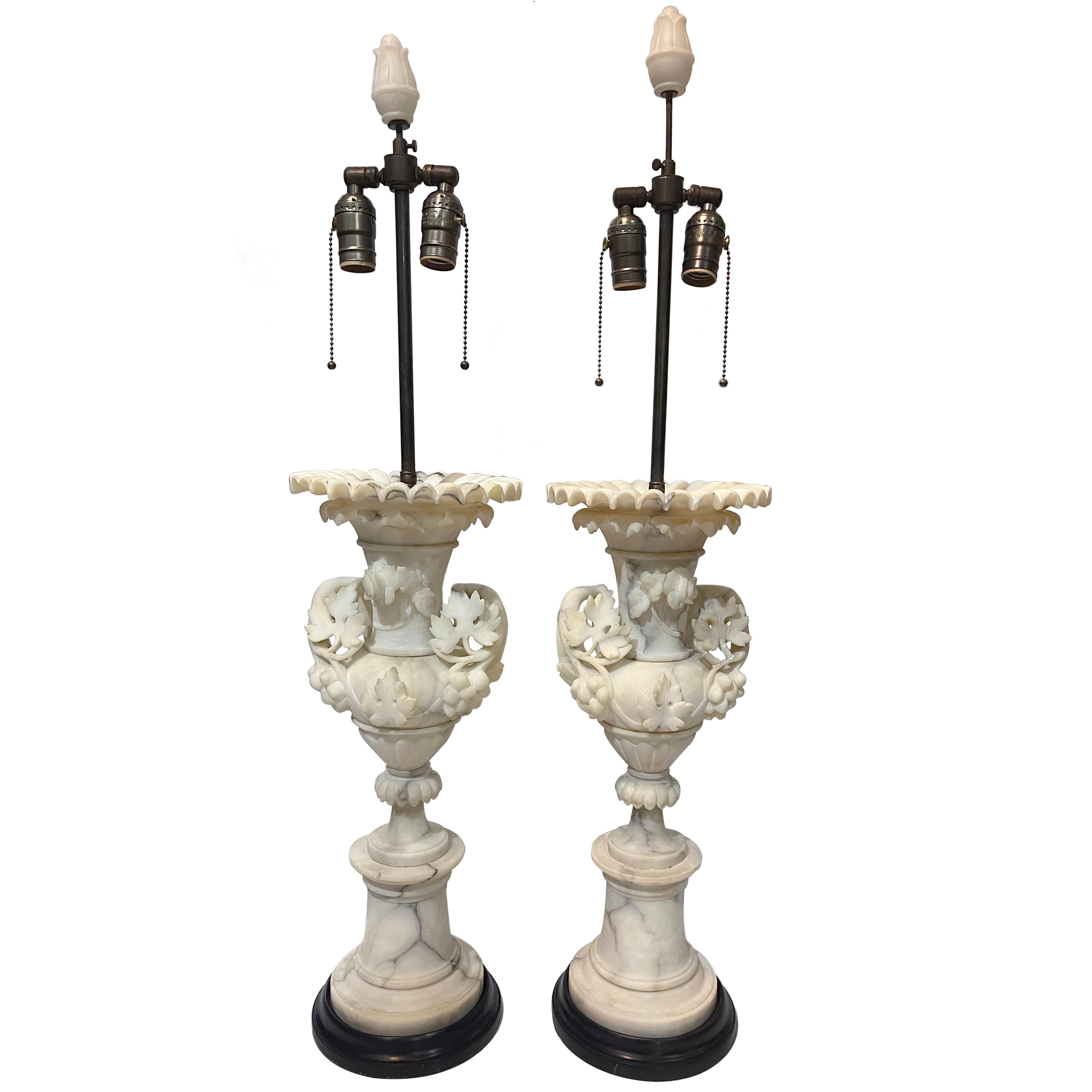 Pair of circa 1930s Italian carved alabaster lamps with elaborate foliage motif.

Measurements:
Height of body 21