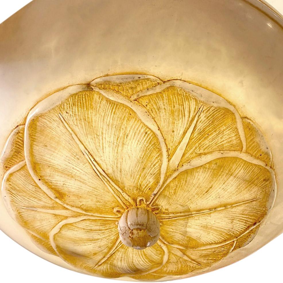 A circa 1920s French hand carved alabaster light fixture with water lily detail on body, interior lights and can be fitted with silk cords, bronze or nickel-plated chains.

Measurements
Minimum drop 7?
Diameter 20?.