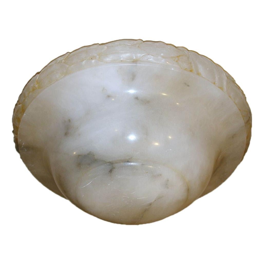 An Italian circa 1920s carved alabaster light fixture with cross-banding detail on body, white with gray veins, to be fitted with bronze chain or silk cords and three interior lights.

Measurements:
Depth 6