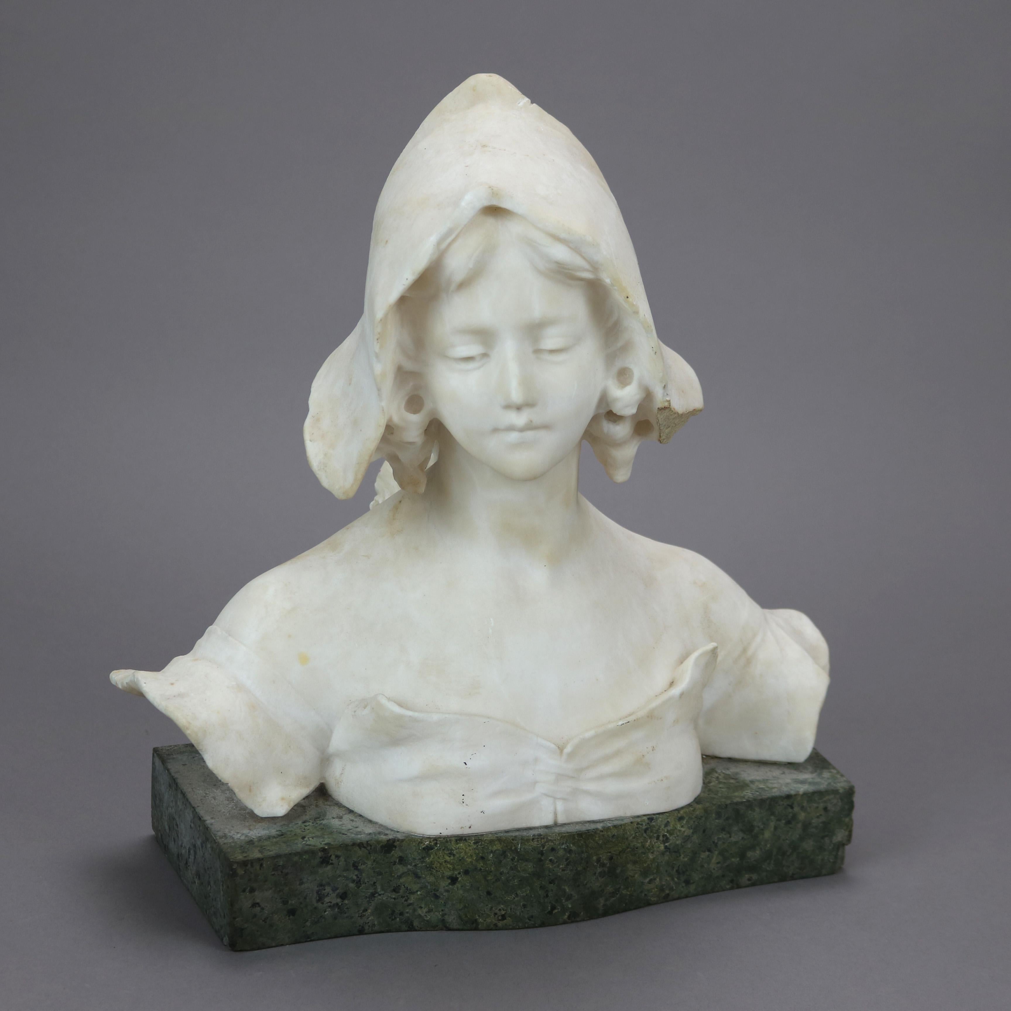 A bust sculpture offers carved alabaster portrait of a young woman, seated on green marble base, c1900

Measures - 12.25''H x 11''W x 5.5''D.