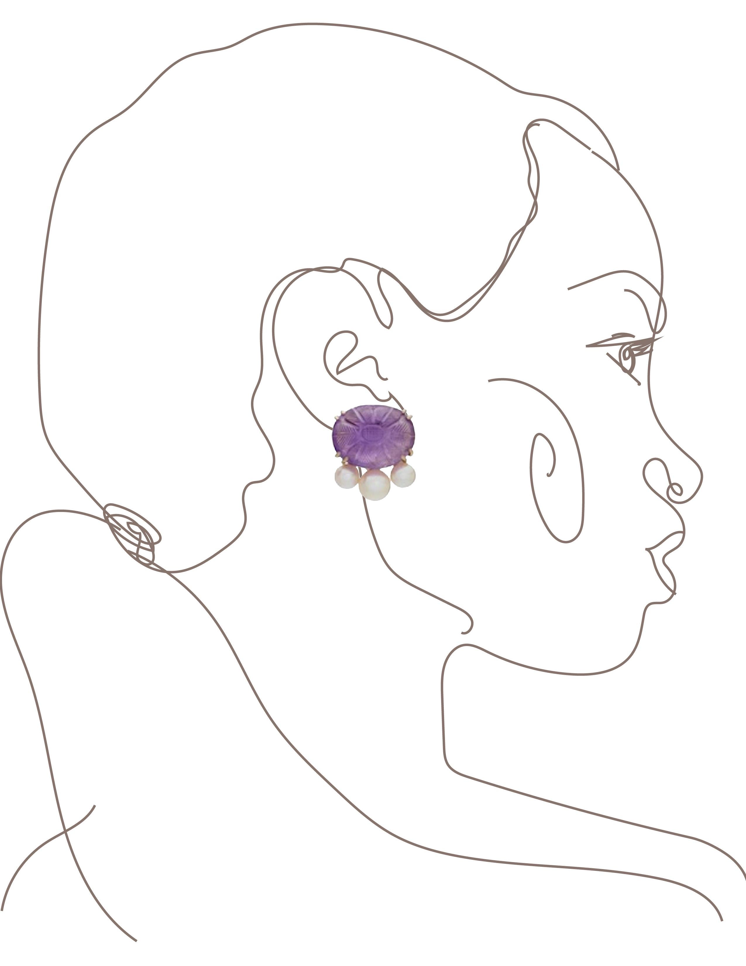 A pair of carved oval shape Amethyst button Earrings with three various size cultured pearls underneath. Set in 18 karat white gold, signed Sorab & Roshi.
Ameth= 32 cts.

3/4